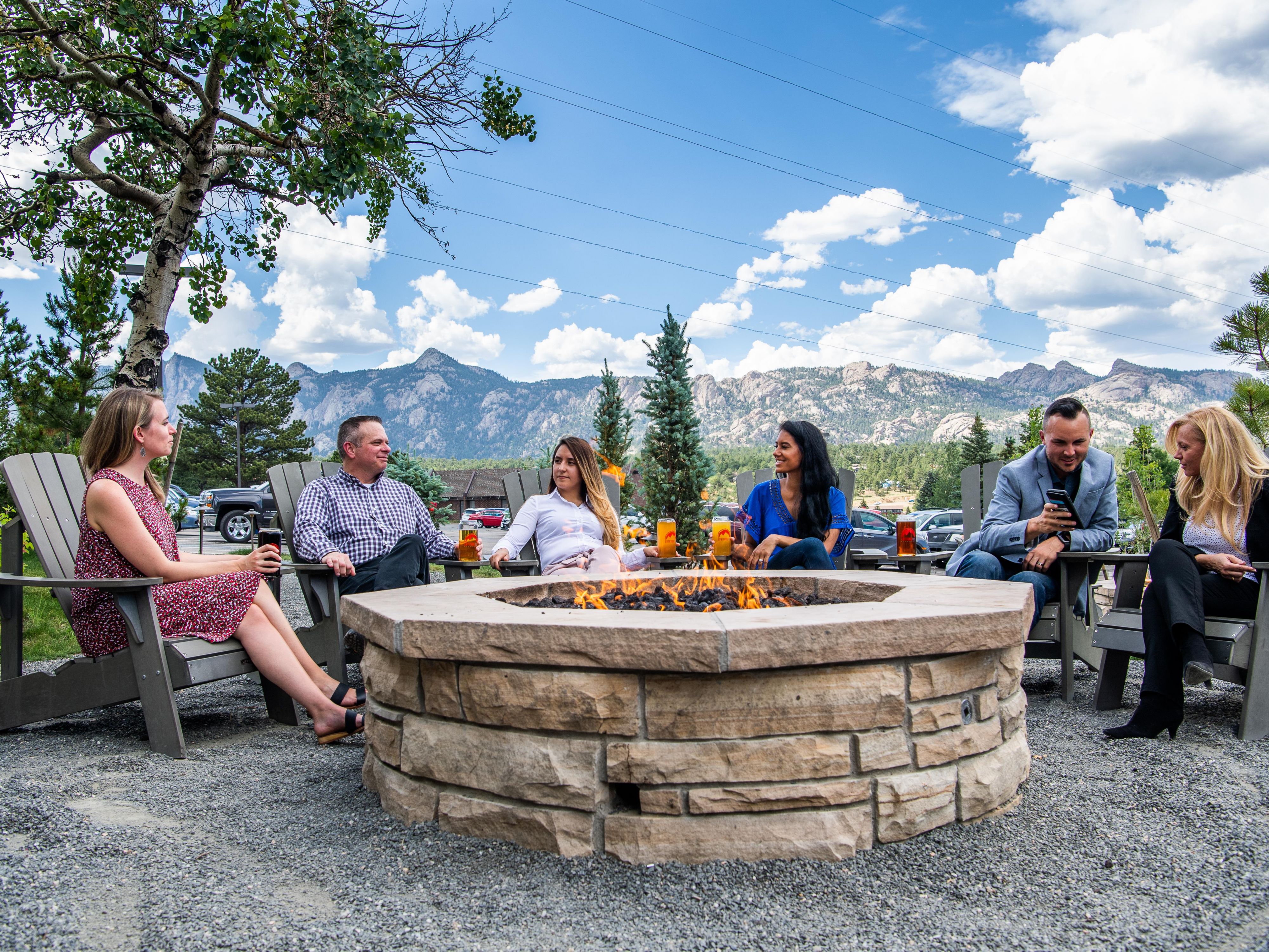 Group meeting around a fire pit