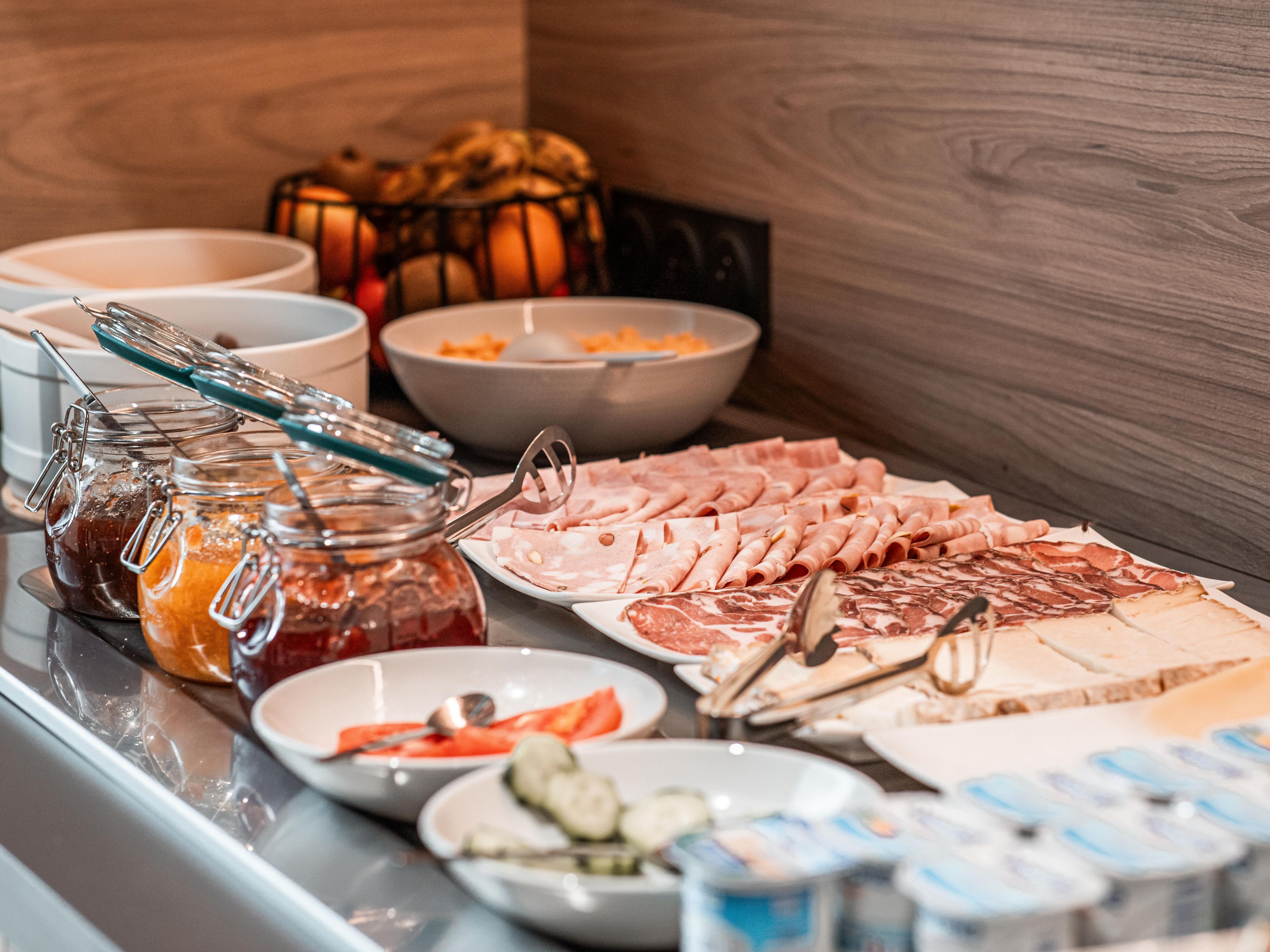 Begin your day with our Free Express Start Breakfast buffet. Enjoy a continental spread featuring fluffy croissants and pastries, along with local cold cuts, eggs, cheeses, and fresh fruit.