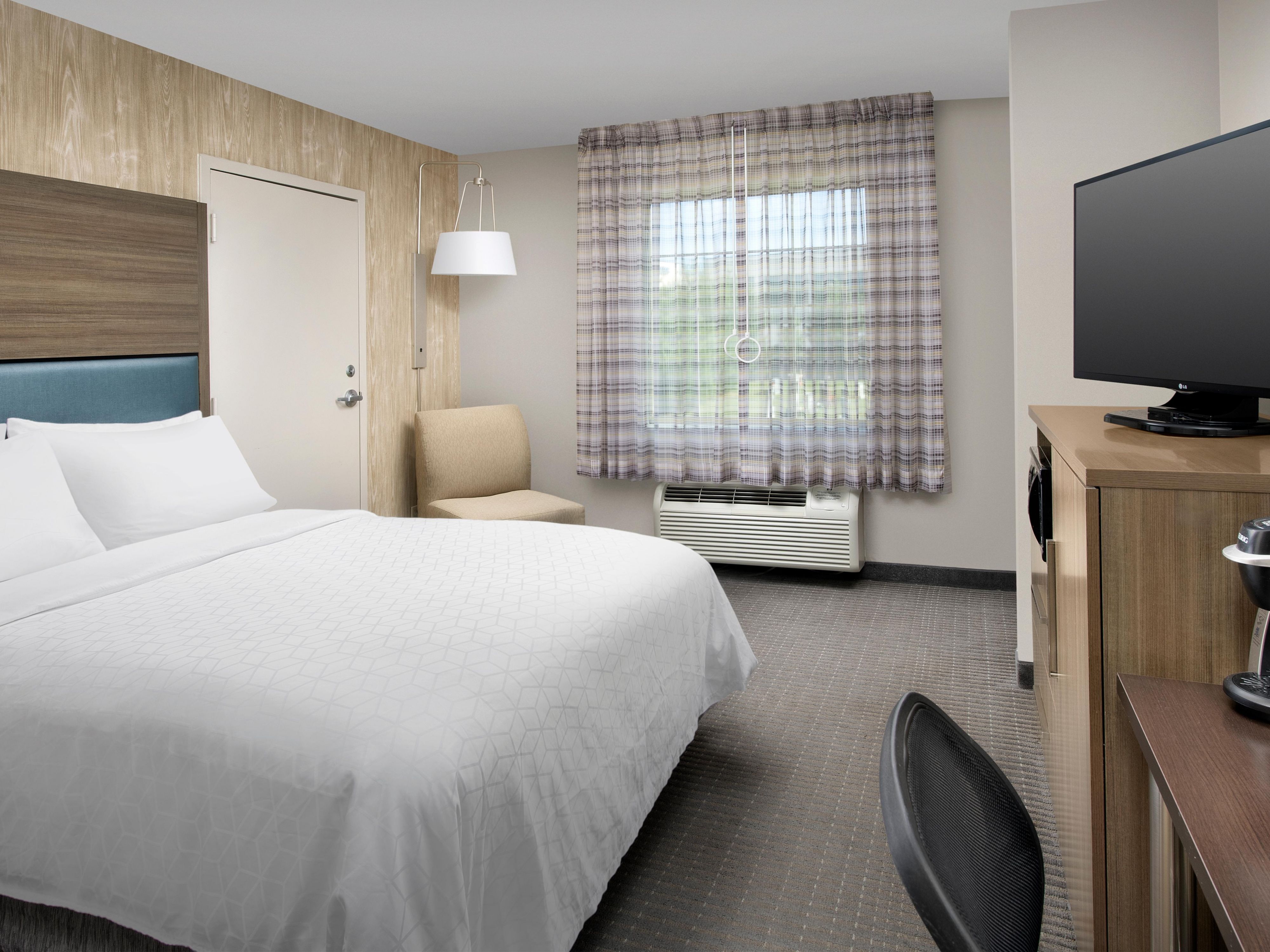Unwind in a king room with natural lighting and top amenities.