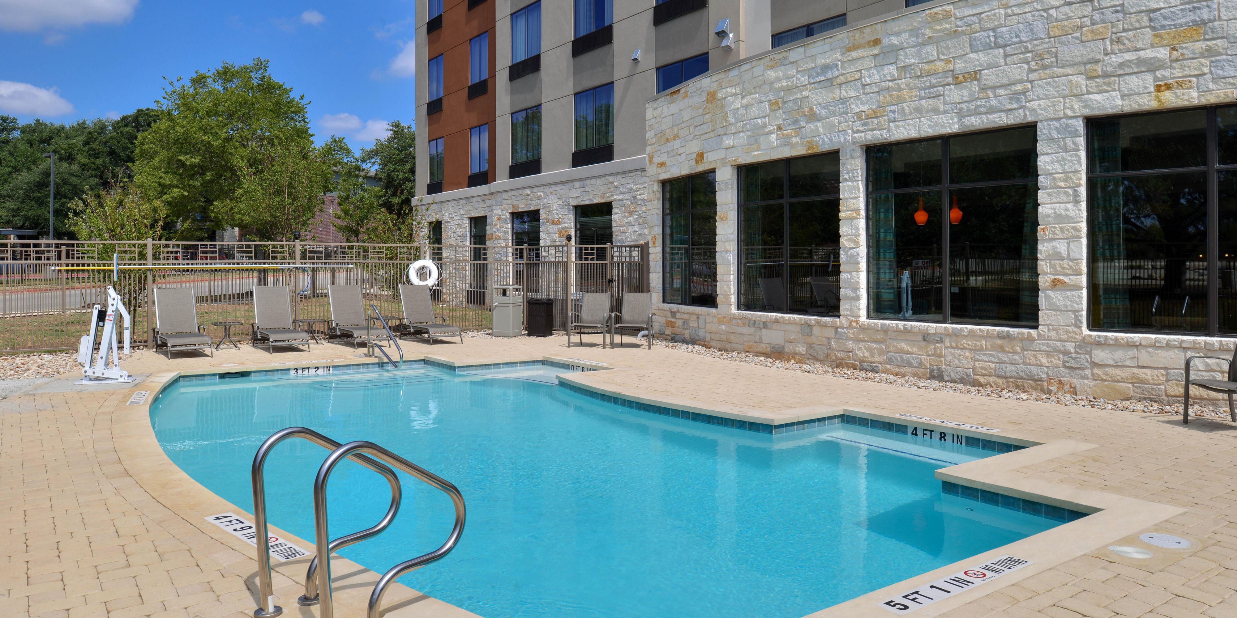 Take a dip in our outdoor pool to cool off in the Texas heat. 