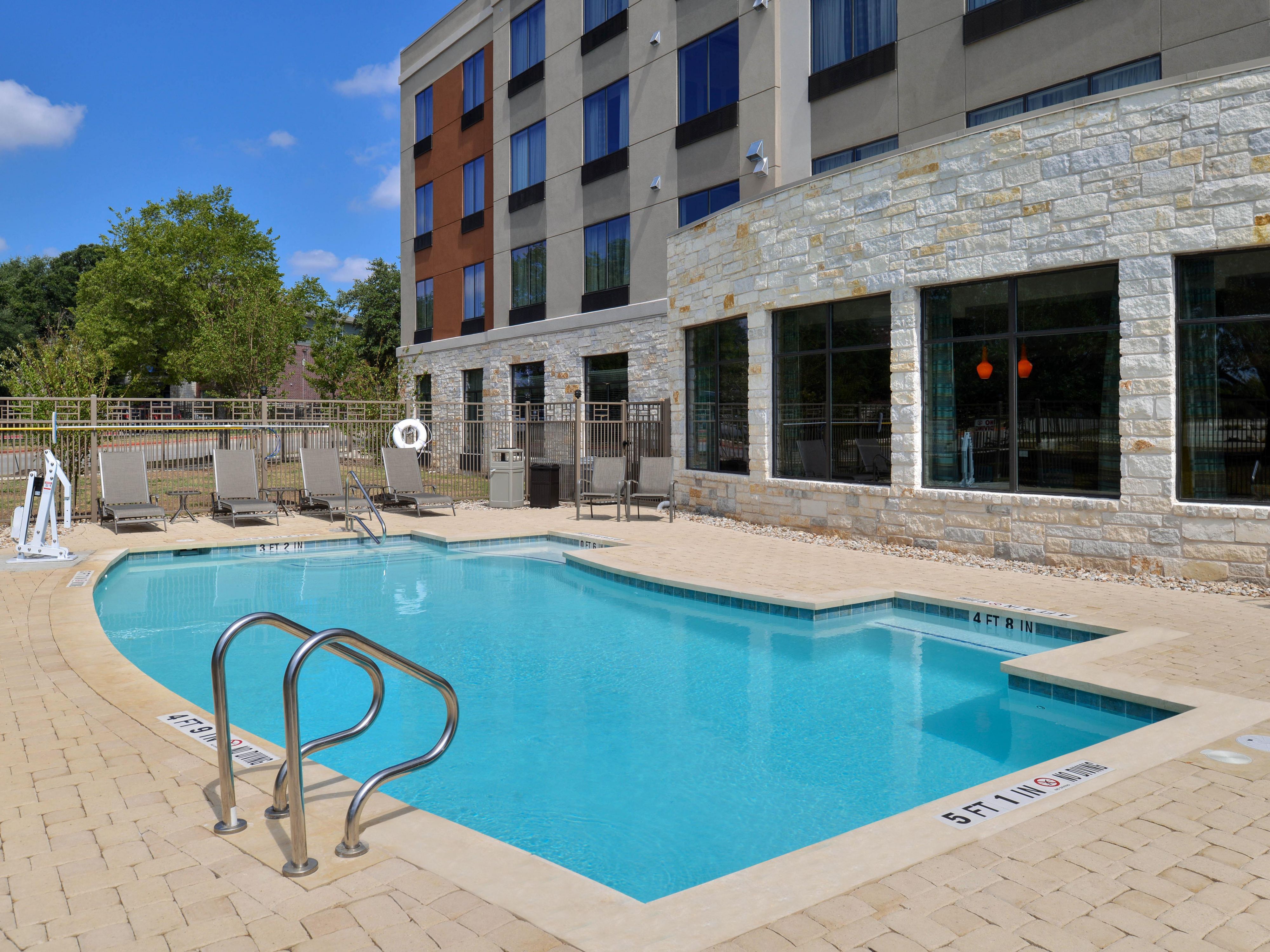Take a dip in our outdoor pool to cool off in the Texas heat.