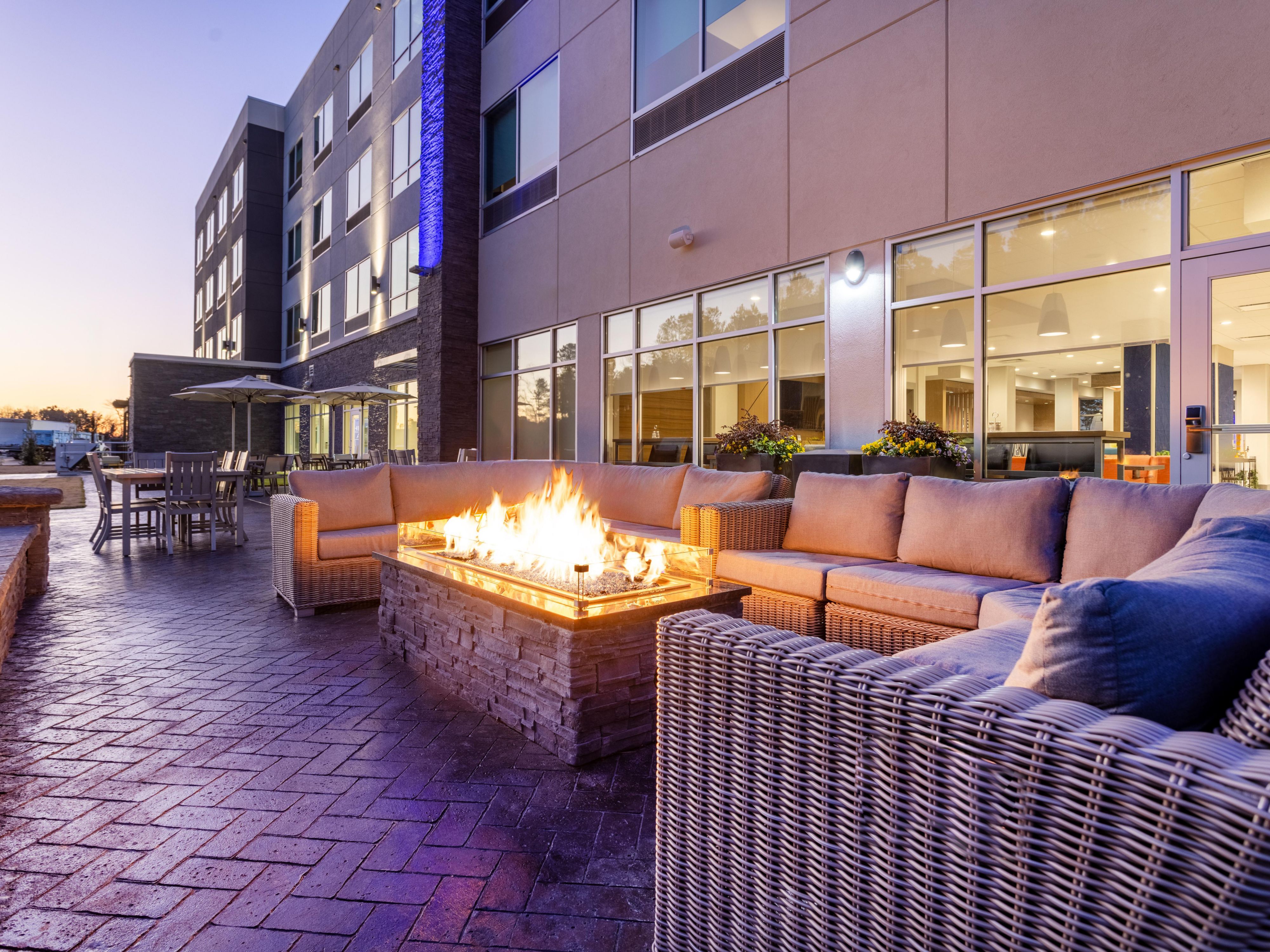 Relax and connect at our hotel’s outdoor firepit and grilling station. Whether you're grilling a delicious meal, or enjoying a cozy evening under the stars, it's the perfect spot to unwind and create lasting memories in a warm, inviting space during your stay.