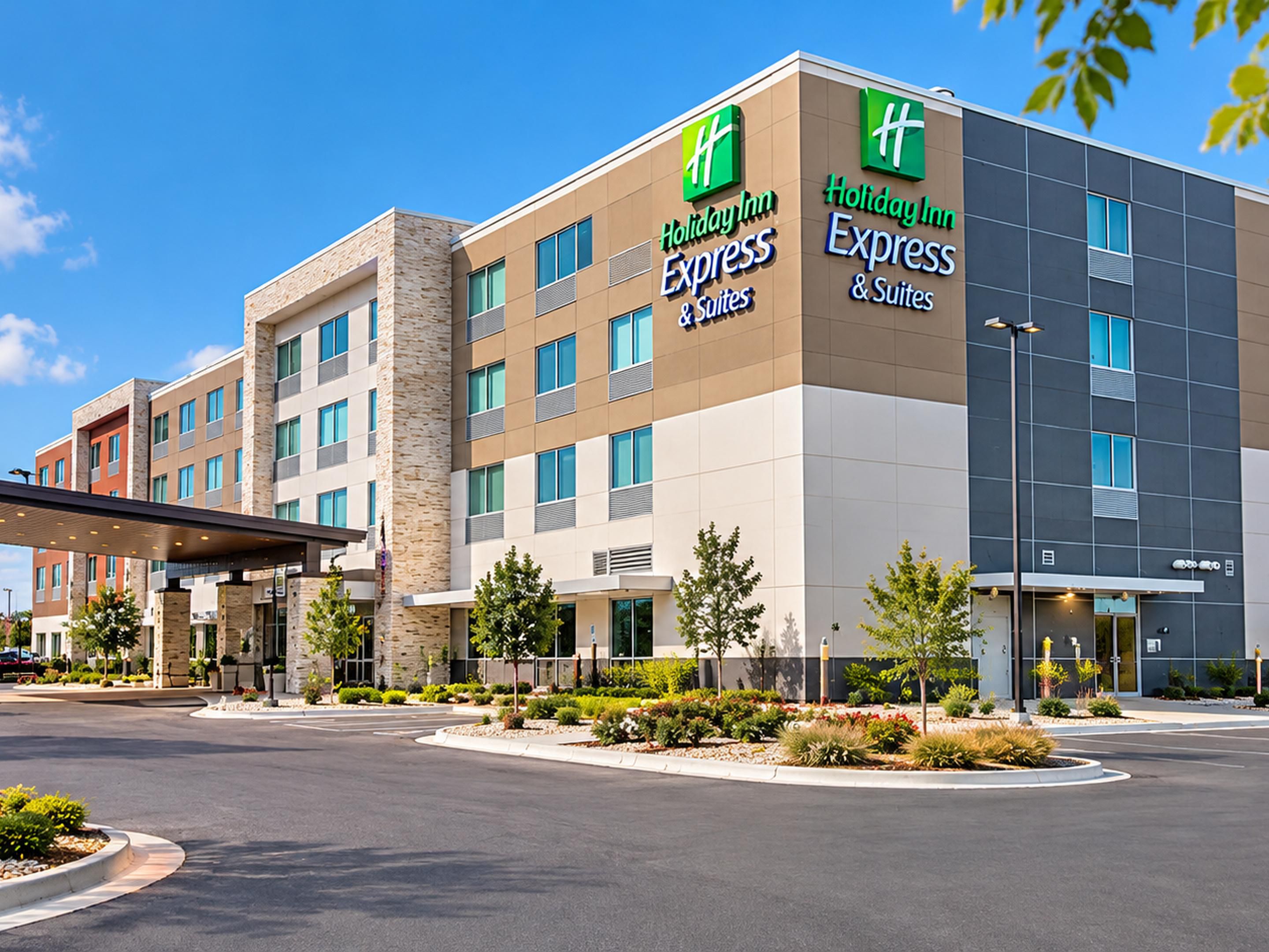 Welcoming hotel exterior surrounded by lush trees and landscaping.