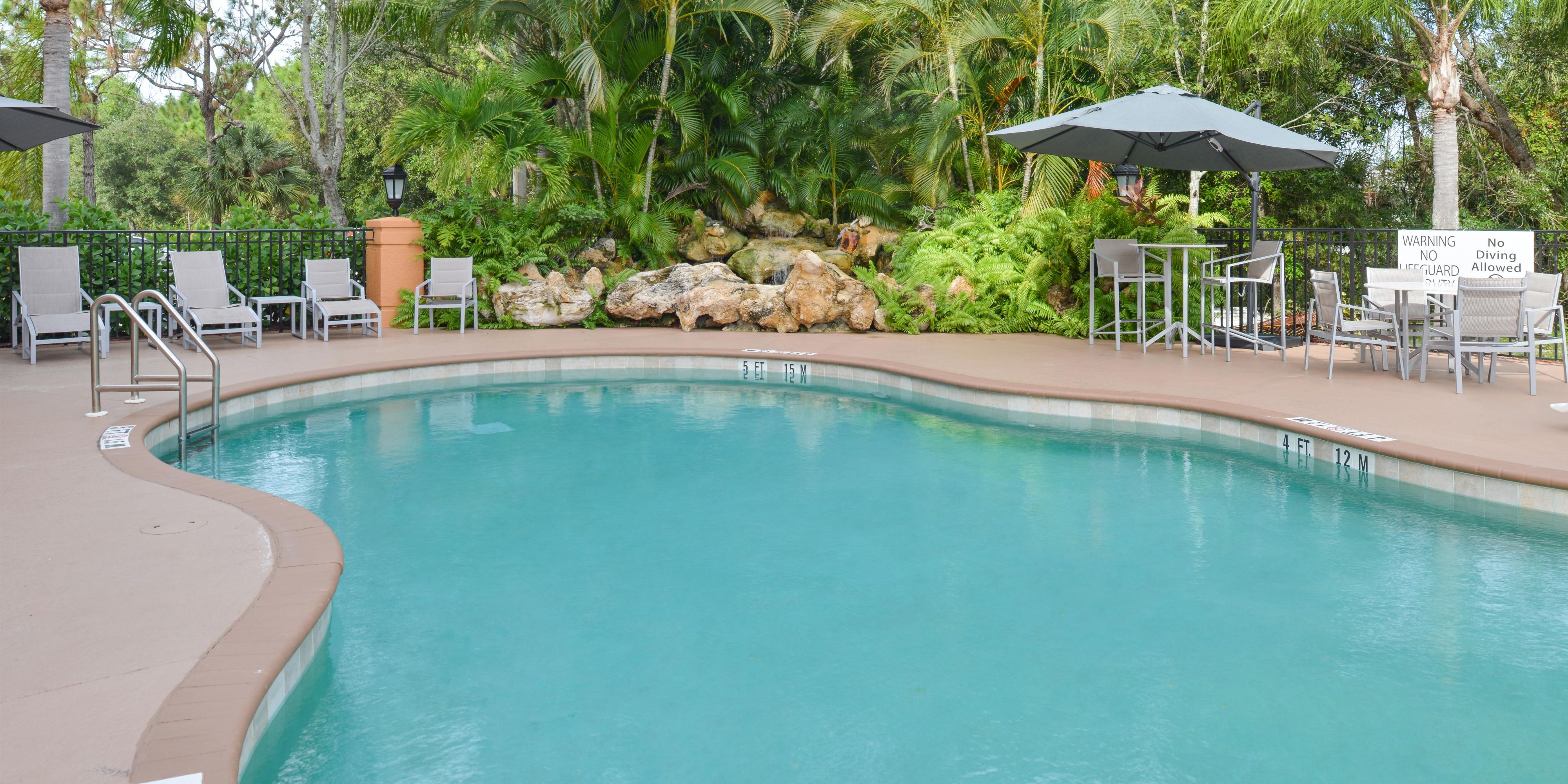 Open from dawn to dusk, relax in the Florida sunshine in our outdoor oasis. Read a book, take few laps, and enjoy the serenity complete with a bubbling waterfall.