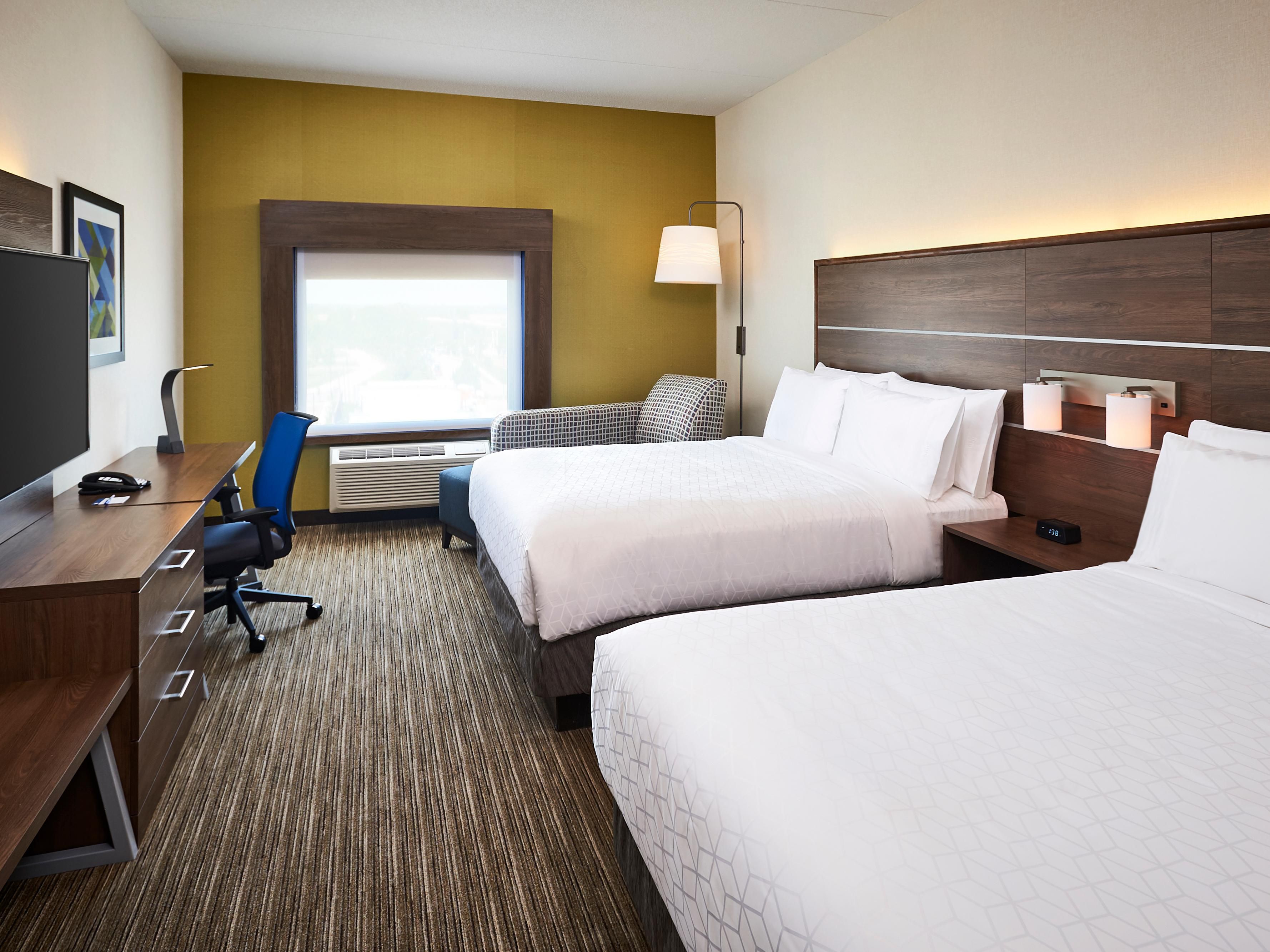 2 Queen Bed room with 55 inch HDTV experience and chaise lounge