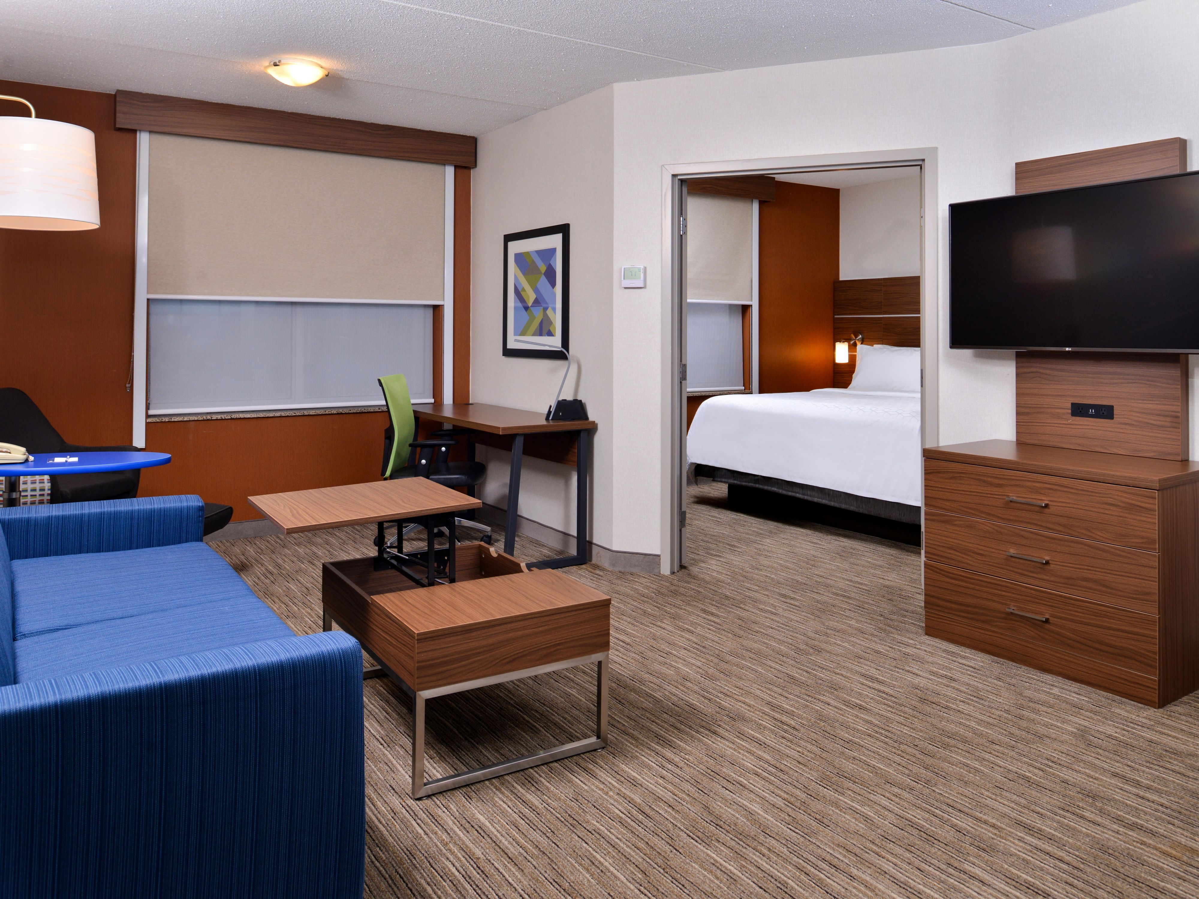 Two room King suite with pullout sofa, 49" tv, and sitting area.