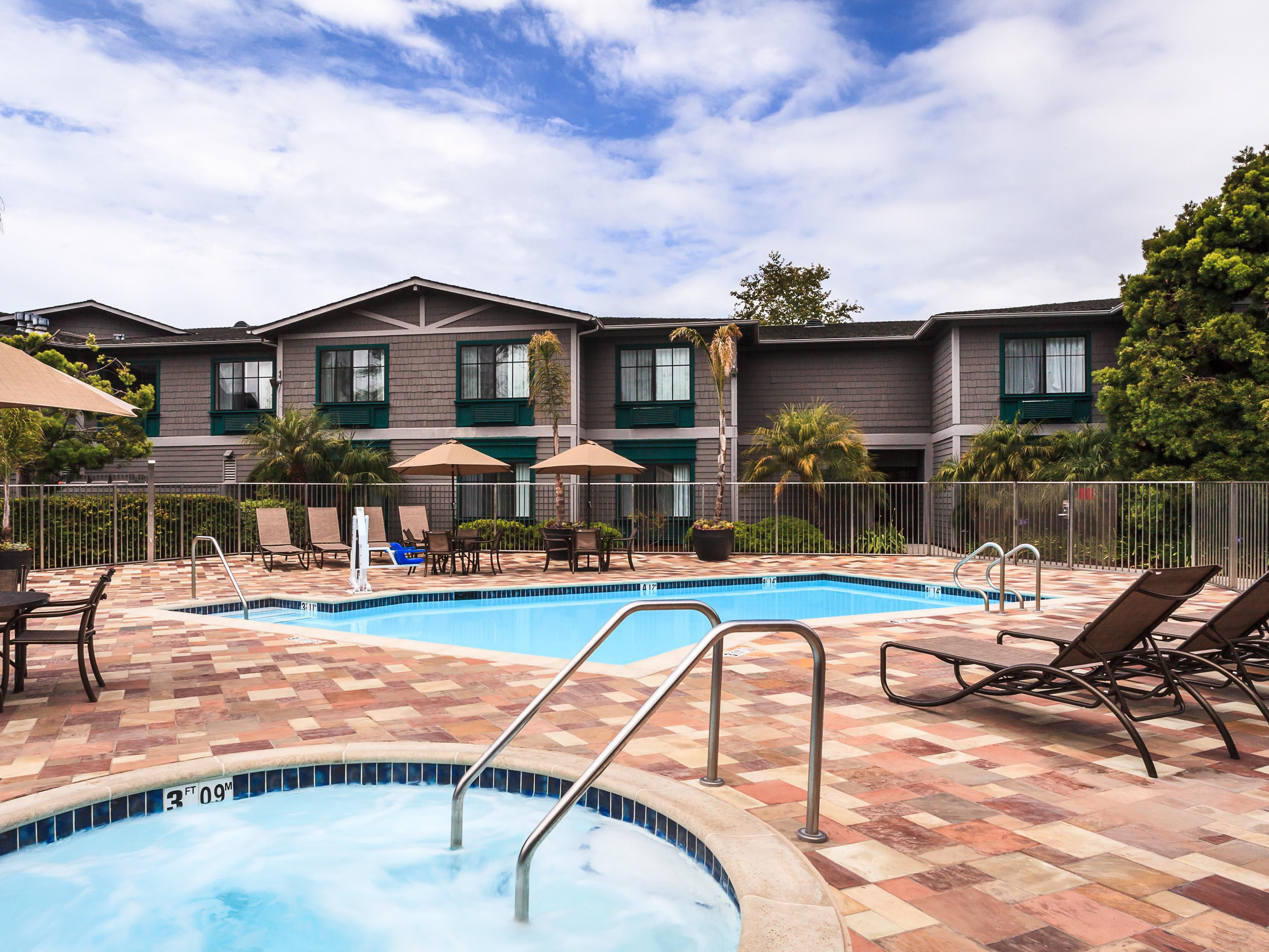 With a jacuzzi, pool, and lounge chairs, relaxation is calling.