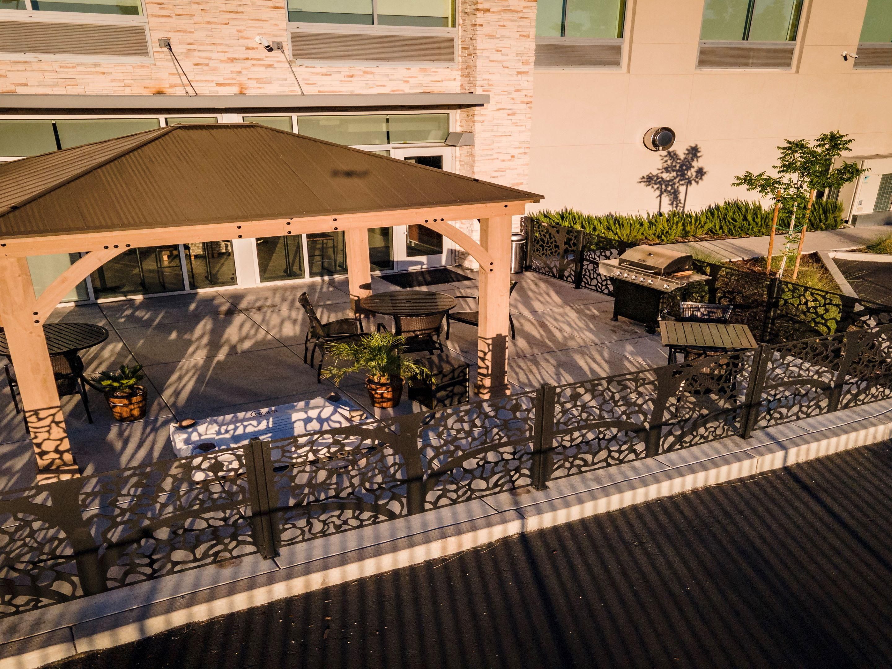 Experience the perfect outdoor setting on our beautiful patio, featuring a cozy fire pit and Traeger Grill. It's an ideal spot to savor an outdoor lunch or dinner under the stars. Whether you're relaxing after a long day or gathering with friends and family, our patio offers a delightful ambiance for any occasion.