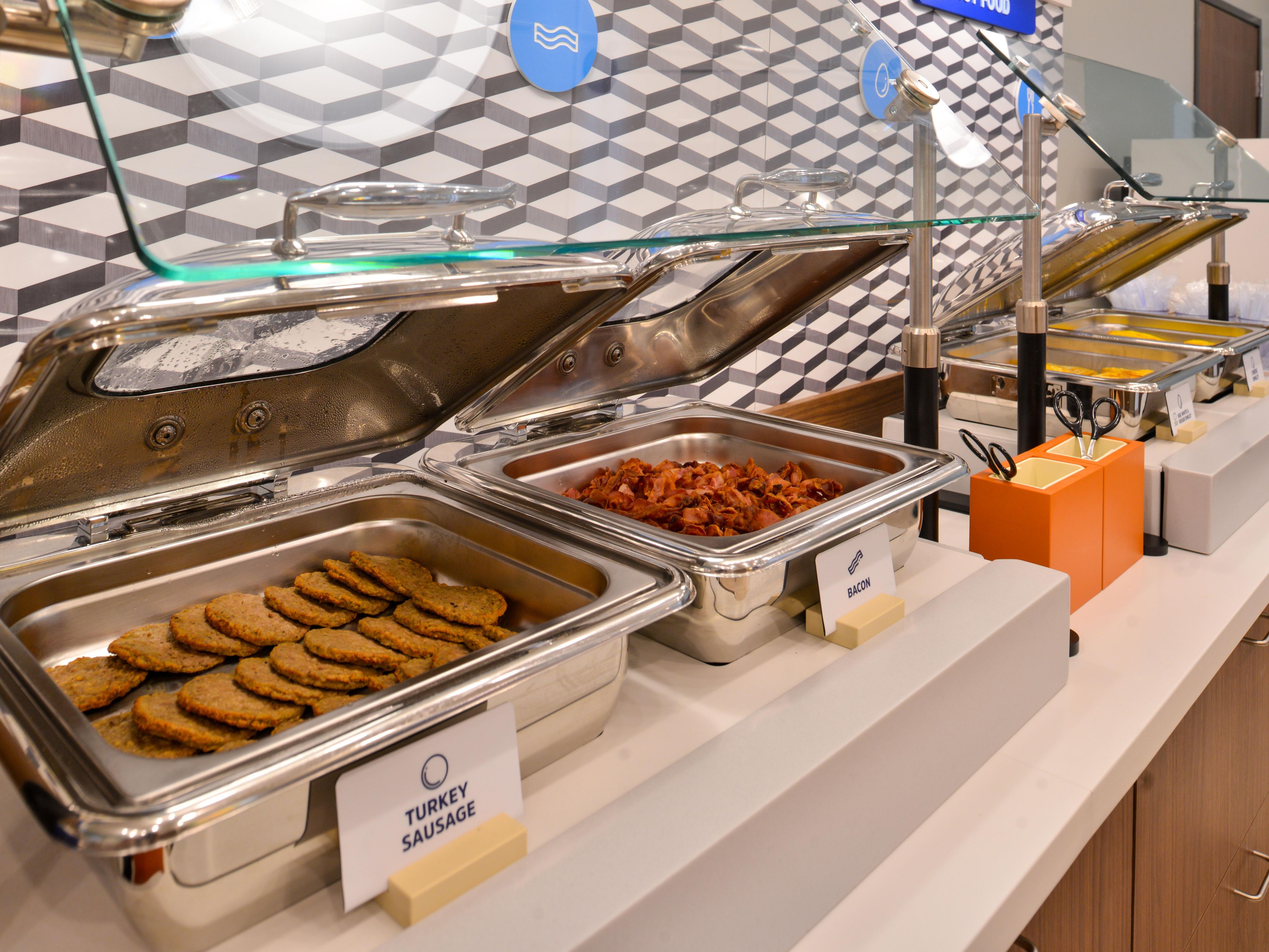 Fuel your day with our complimentary Express Start® Breakfast buffet filled with delicious hot and cold selections. Enjoy classic favorites like scrambled eggs, sausage or bacon, and pancakes, plus, cereal, yogurt, and fresh fruit. Save room for our signature cinnamon rolls! Served daily 6:00 AM – 9:00 AM.