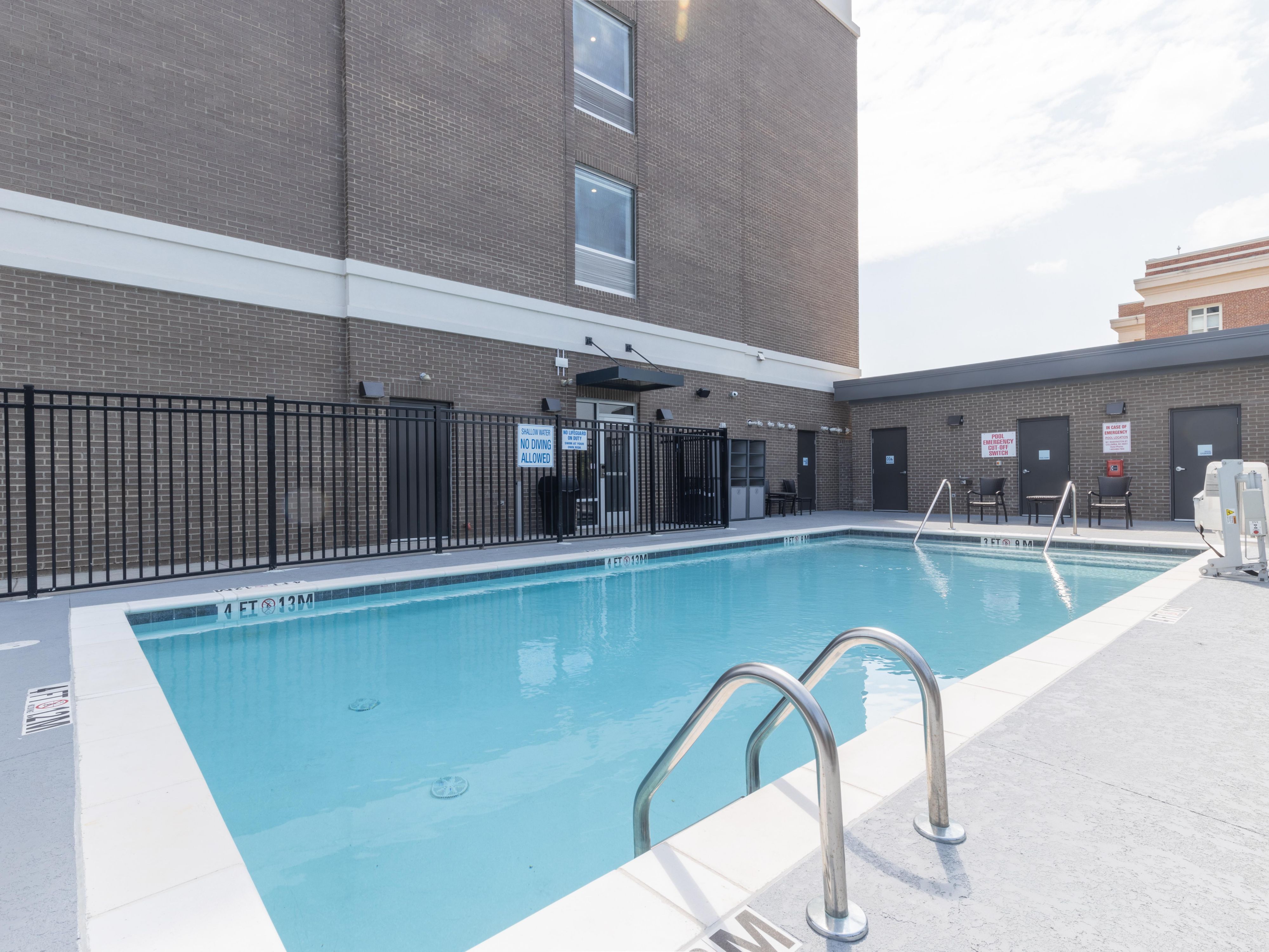 Relax poolside with a book or float in the calm waters.