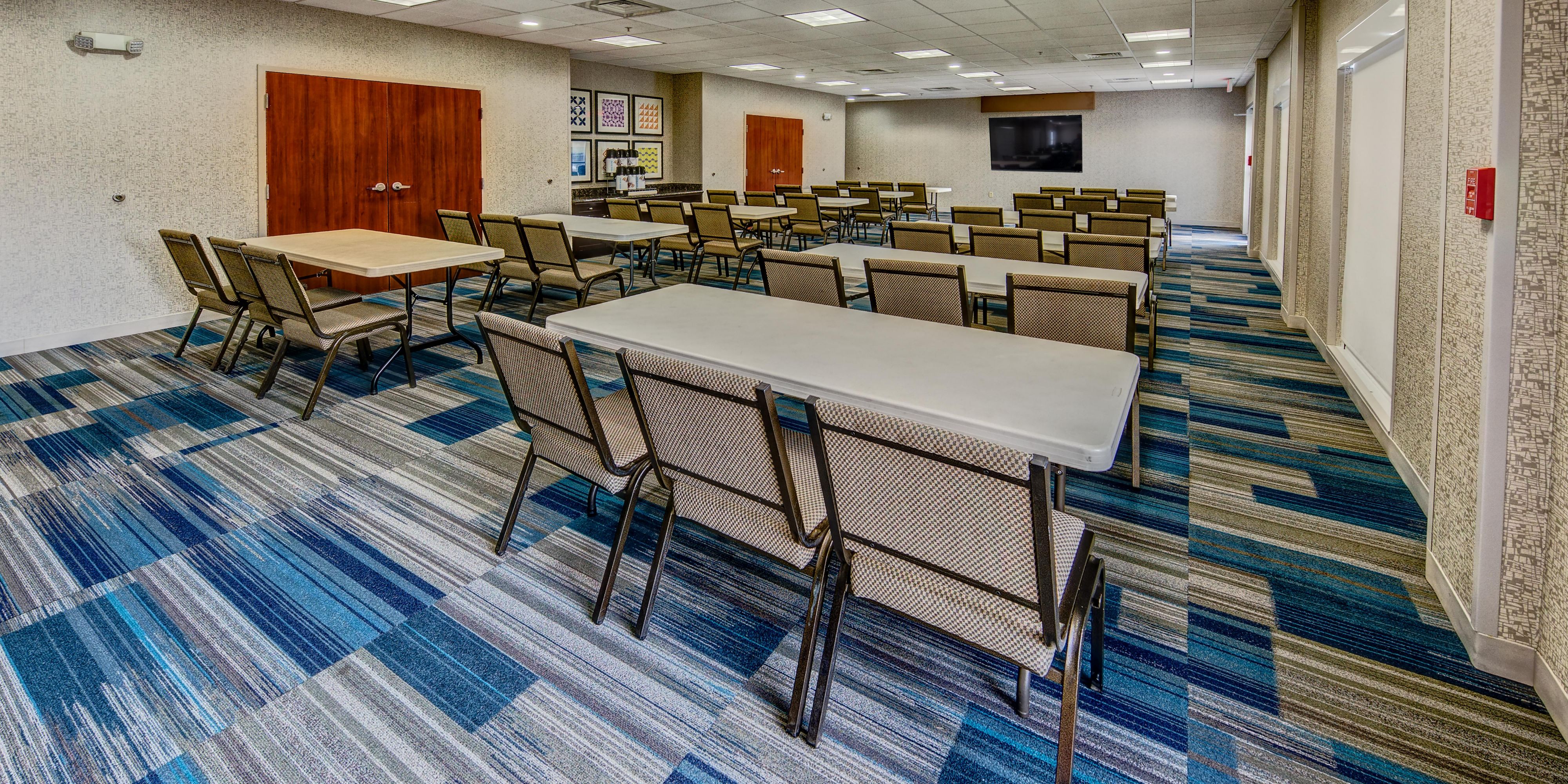 The Holiday Inn Express meeting room is perfect for your needs.  The space holds up to 70 people and can be used for business meetings, conferences, family events and celebrations. The space features entry from the hotel as well as access from the parking lot.