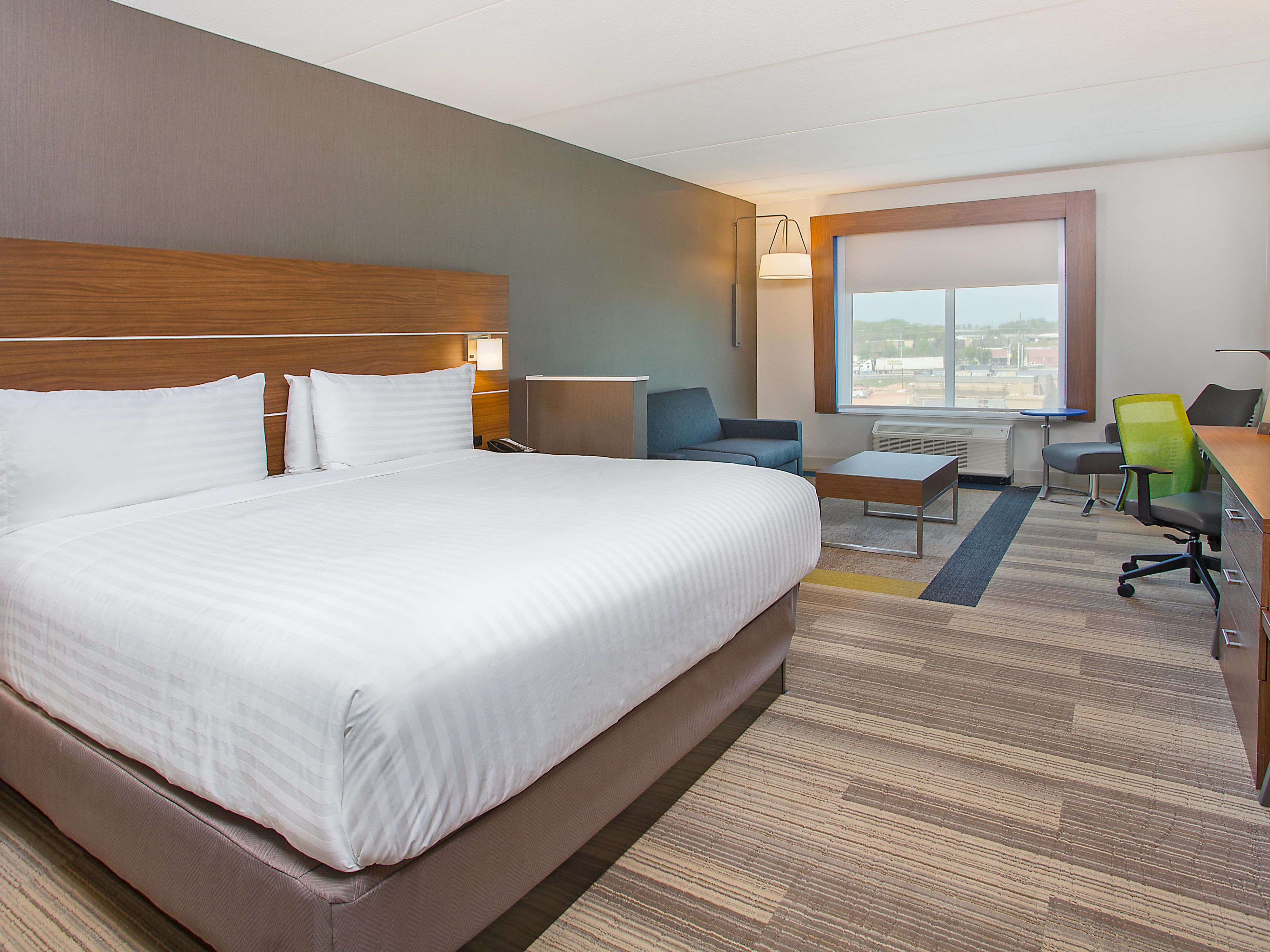 Furnished room with a large window, extra space & natural light.