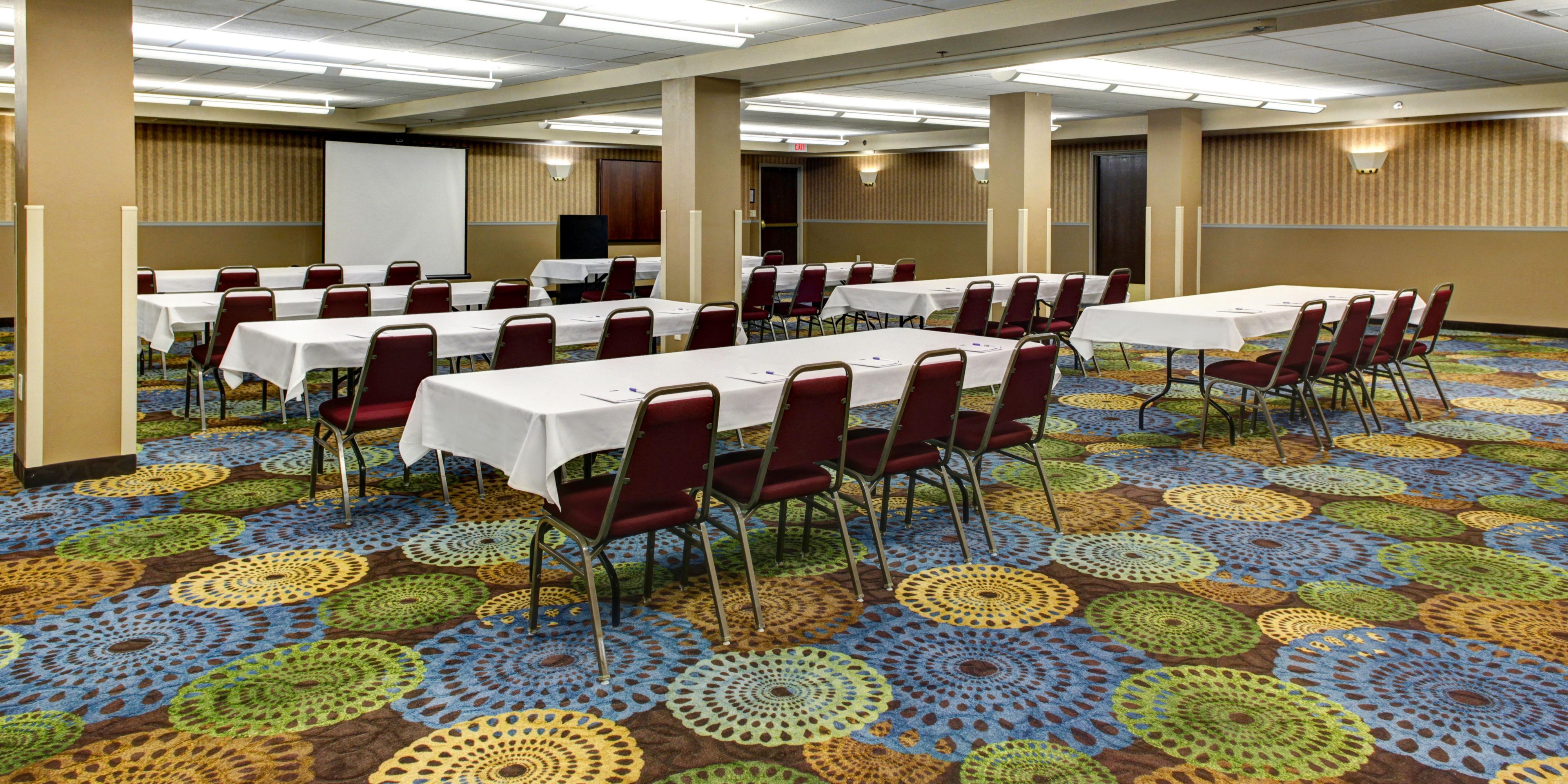 Plan your next event and meeting at the Holiday Inn Express and Suites. Our event space will comfortably accommodate 150 people. In addition, we are able to set the space to your party's needs. For instance, displayed, is a classroom set-up. However, our hotel has the ability to set the space to entertain and host banquets & presentations as well.