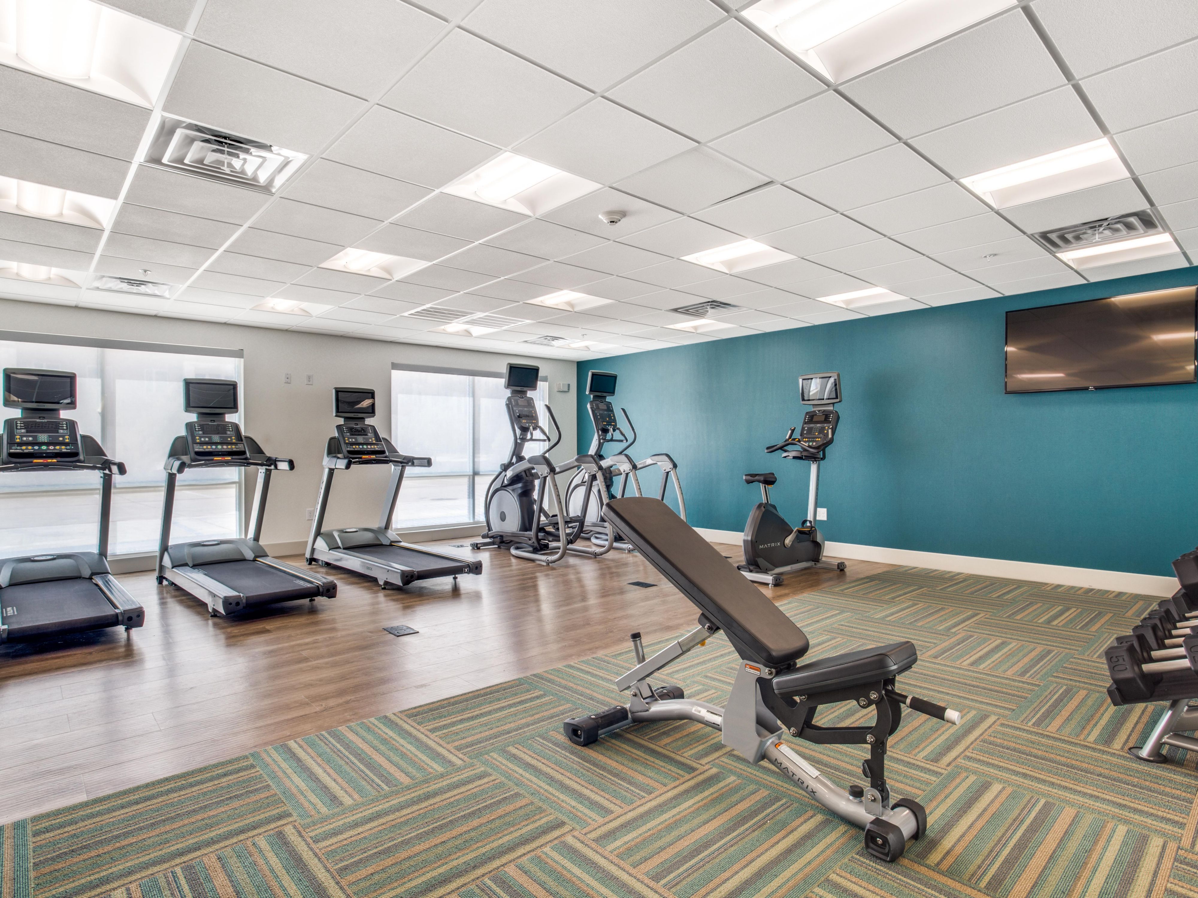Our complimentary fitness center is open daily from 6:00 AM to 12:00 AM for your convenience. It is fully equipped with modern exercise machines, including a treadmill, stationary bike, and free weights, so you can easily maintain your workout routine during your stay.