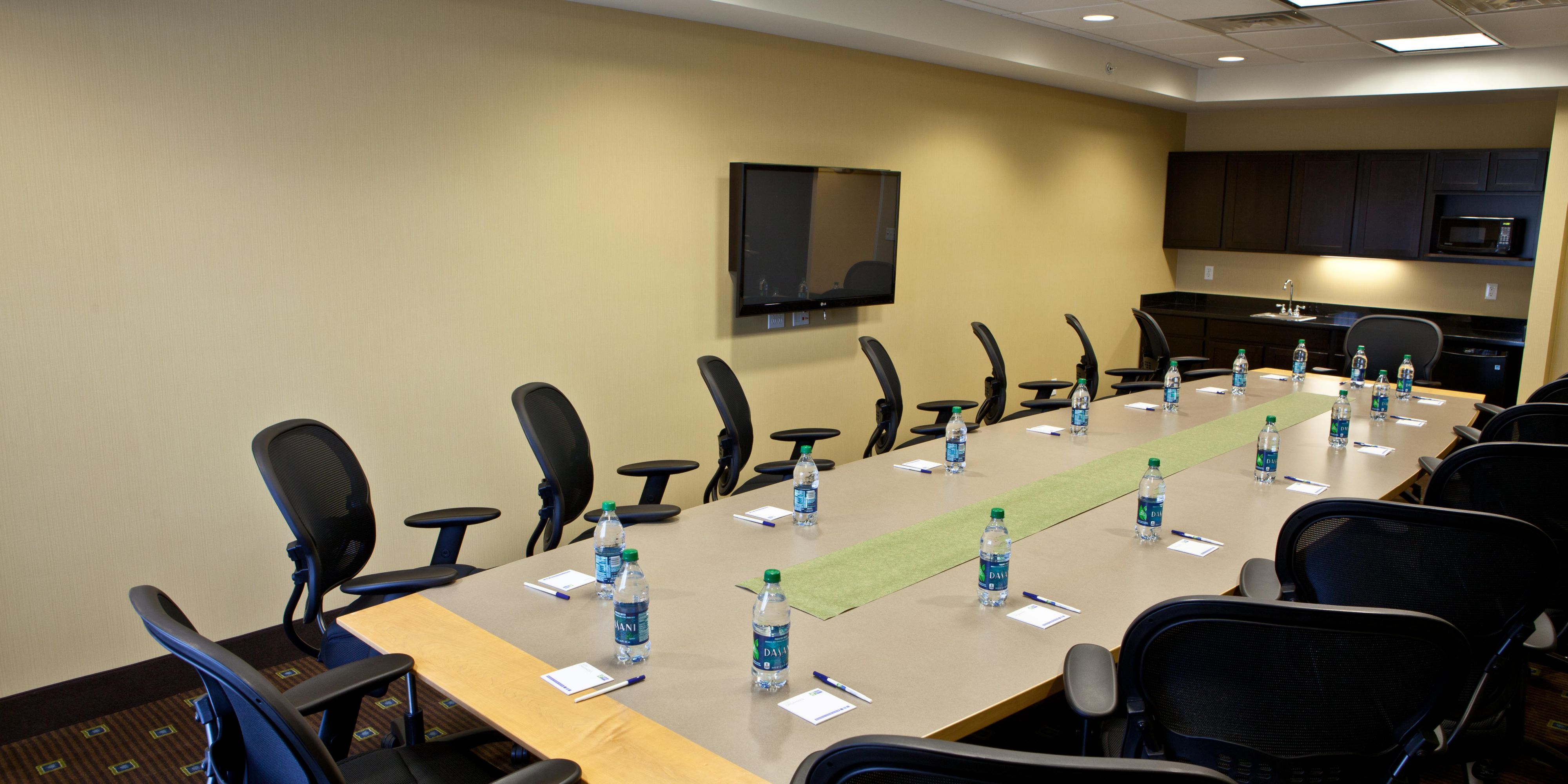Our quaint 15-person board room is the perfect space for your group. Equipped with up to date technology including a teleconference line and flat screen TV for presentations, as well as a kitchenette including a refrigerator and microwave, complimentary Wi-Fi and Business Center is available for any of your office needs.