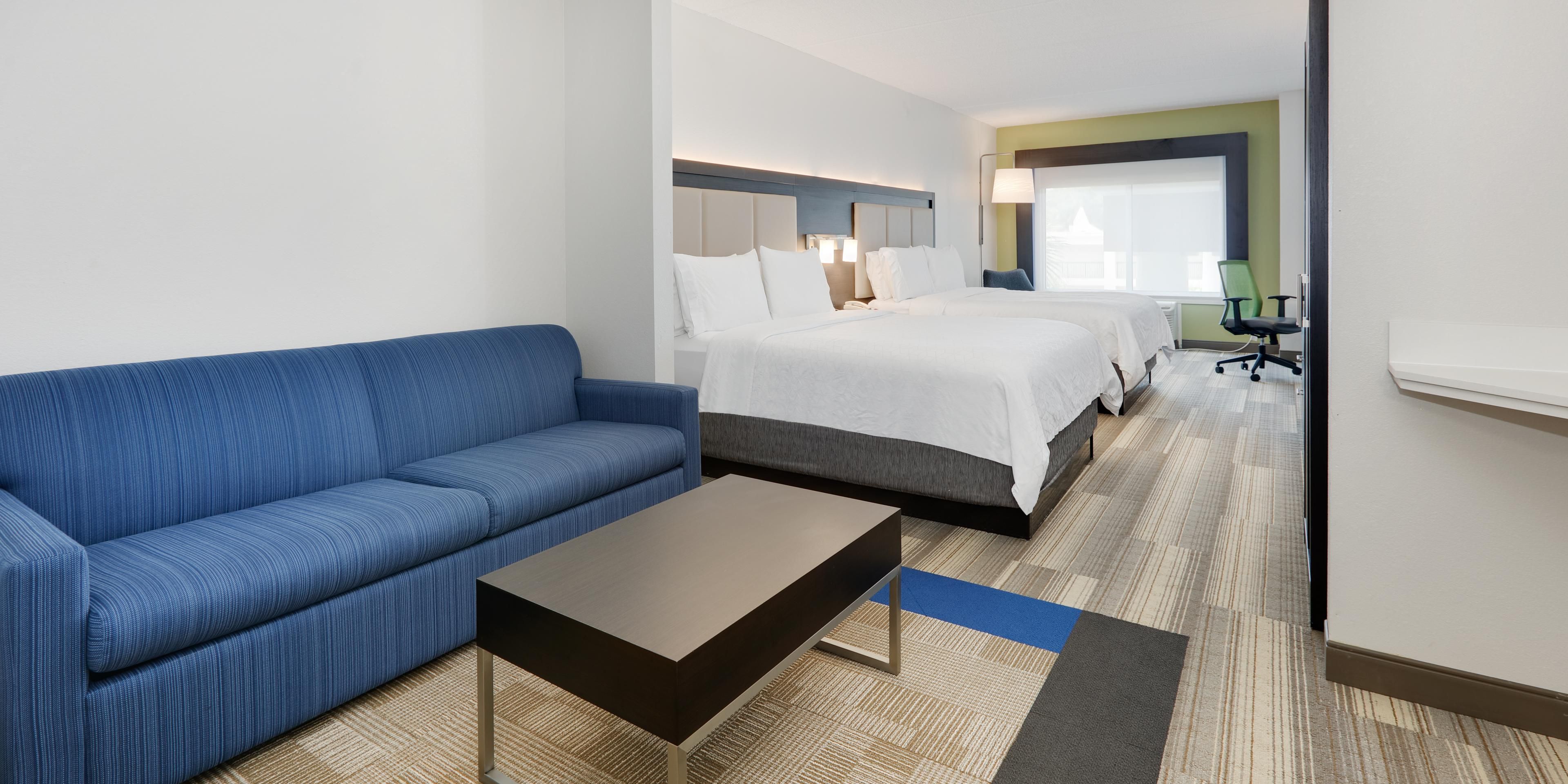 Relax in our spacious suite with two queen size beds and a sleeper sofa. Every room offers complimentary Wi-Fi, a mini-fridge, microwave, Keurig coffeemaker, hairdryer, iron/board, and personal safe. Wake up after a restful sleep in our new pillow-top mattresses and enjoy our complimentary hot breakfast buffet. 