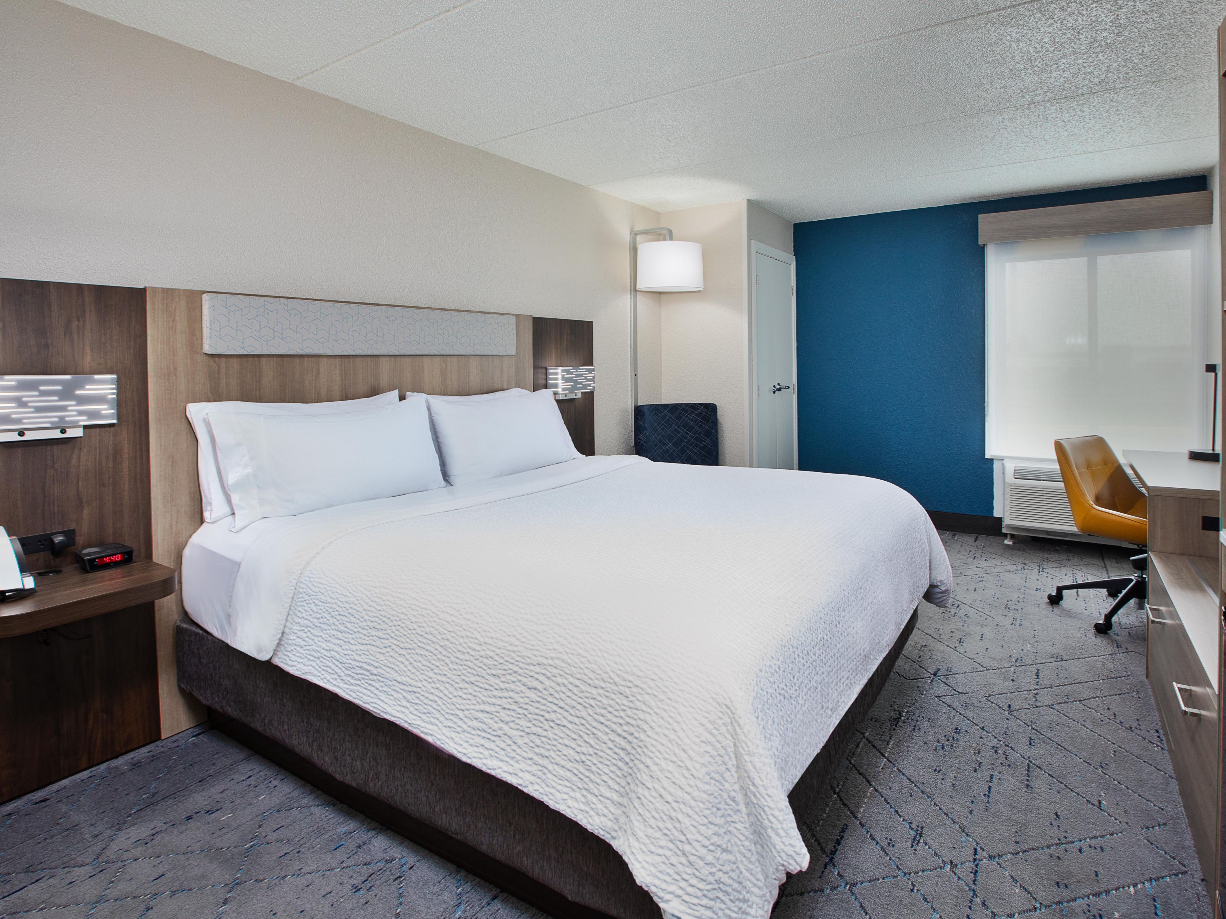 Spacious king guestroom with work desk and modern amenities