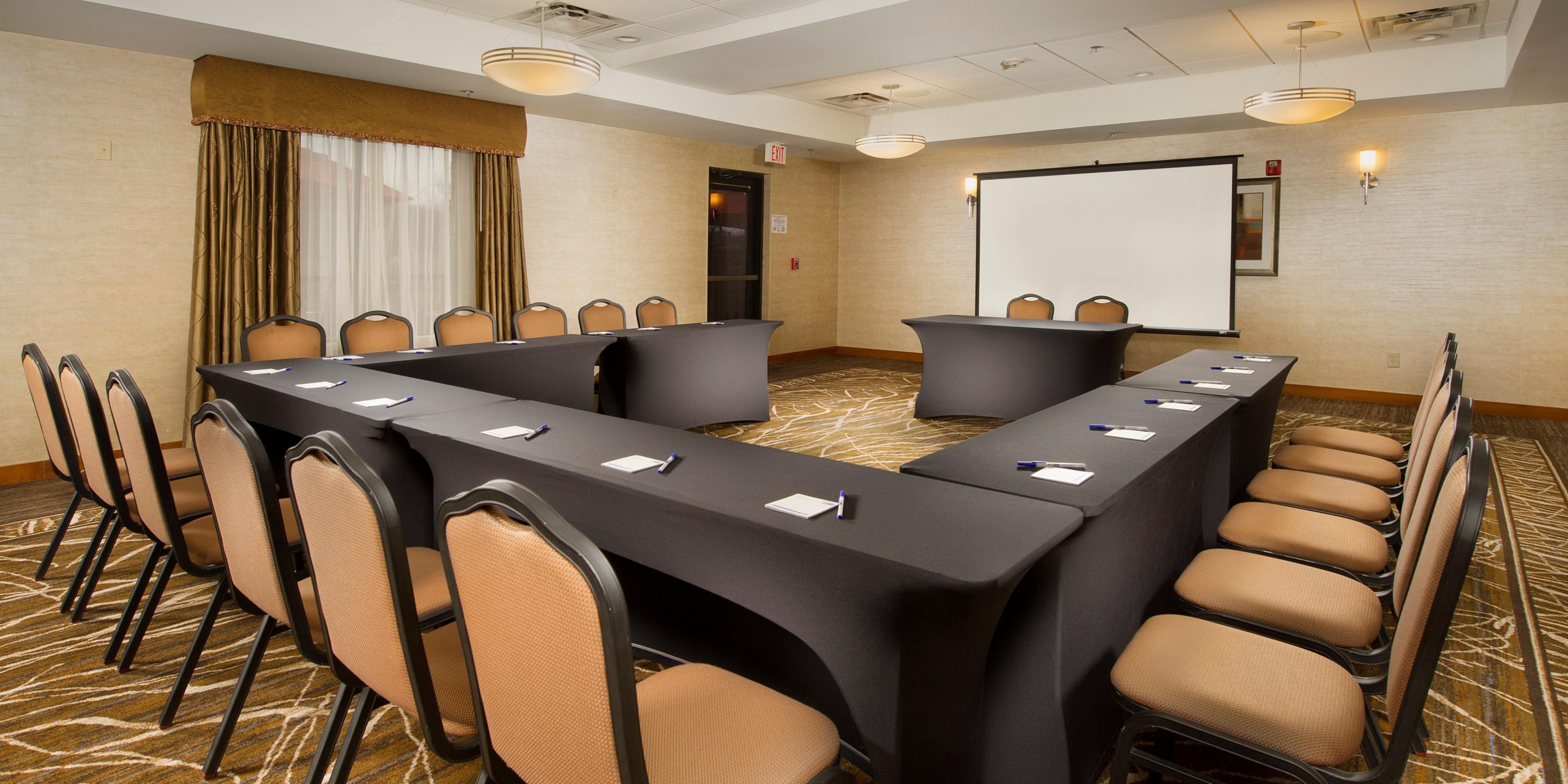Host your next corporate meeting or social gathering in 912 sq. ft. of contemporary meeting space. Seating for a maximum of 60 people, patio off of meeting room, wet bar, complimentary wireless internet, conference phone, LCD projector available for rental. Bring your own food or order from local caterers.