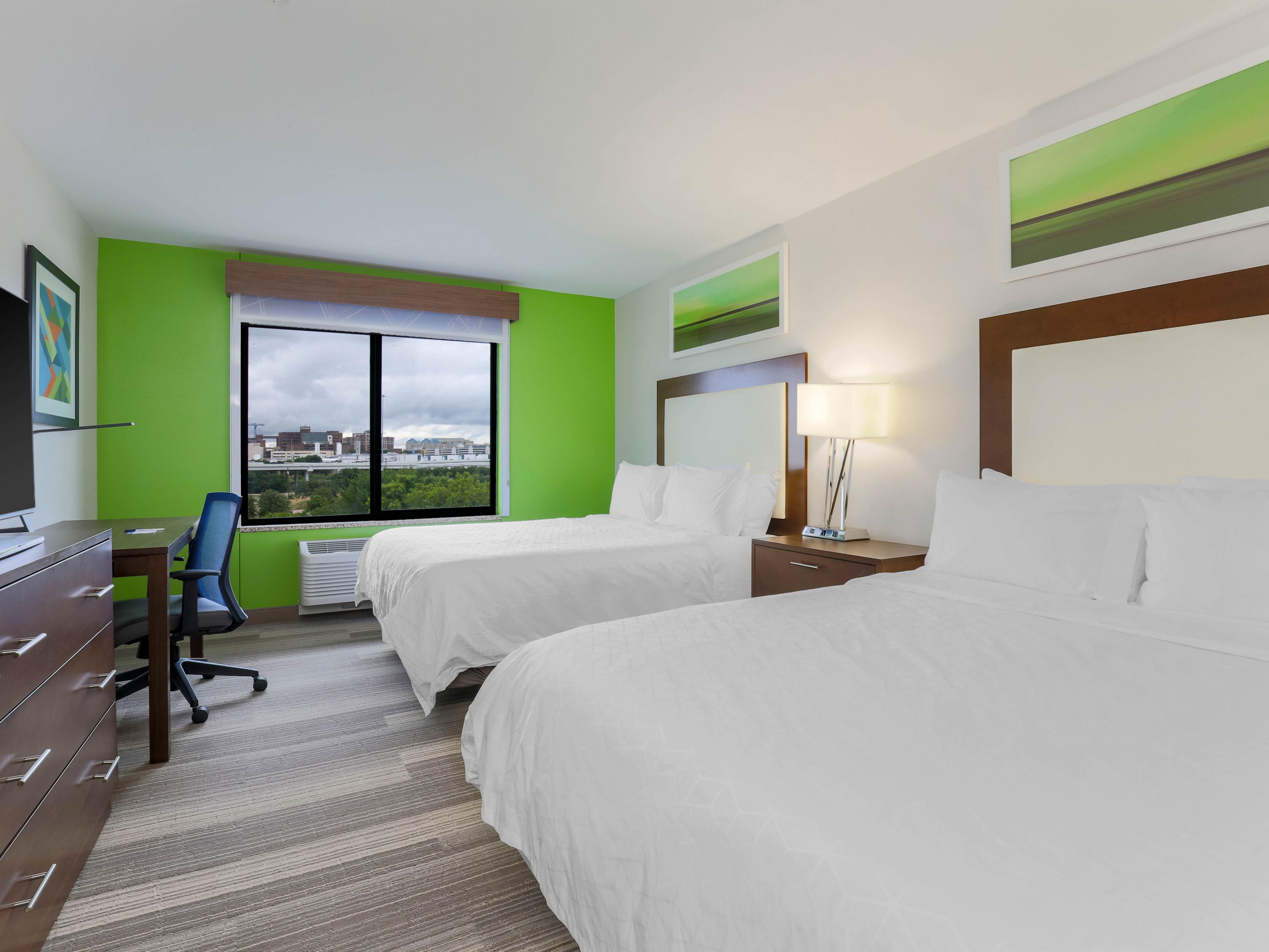 Two queen beds provide added space for family or friends.