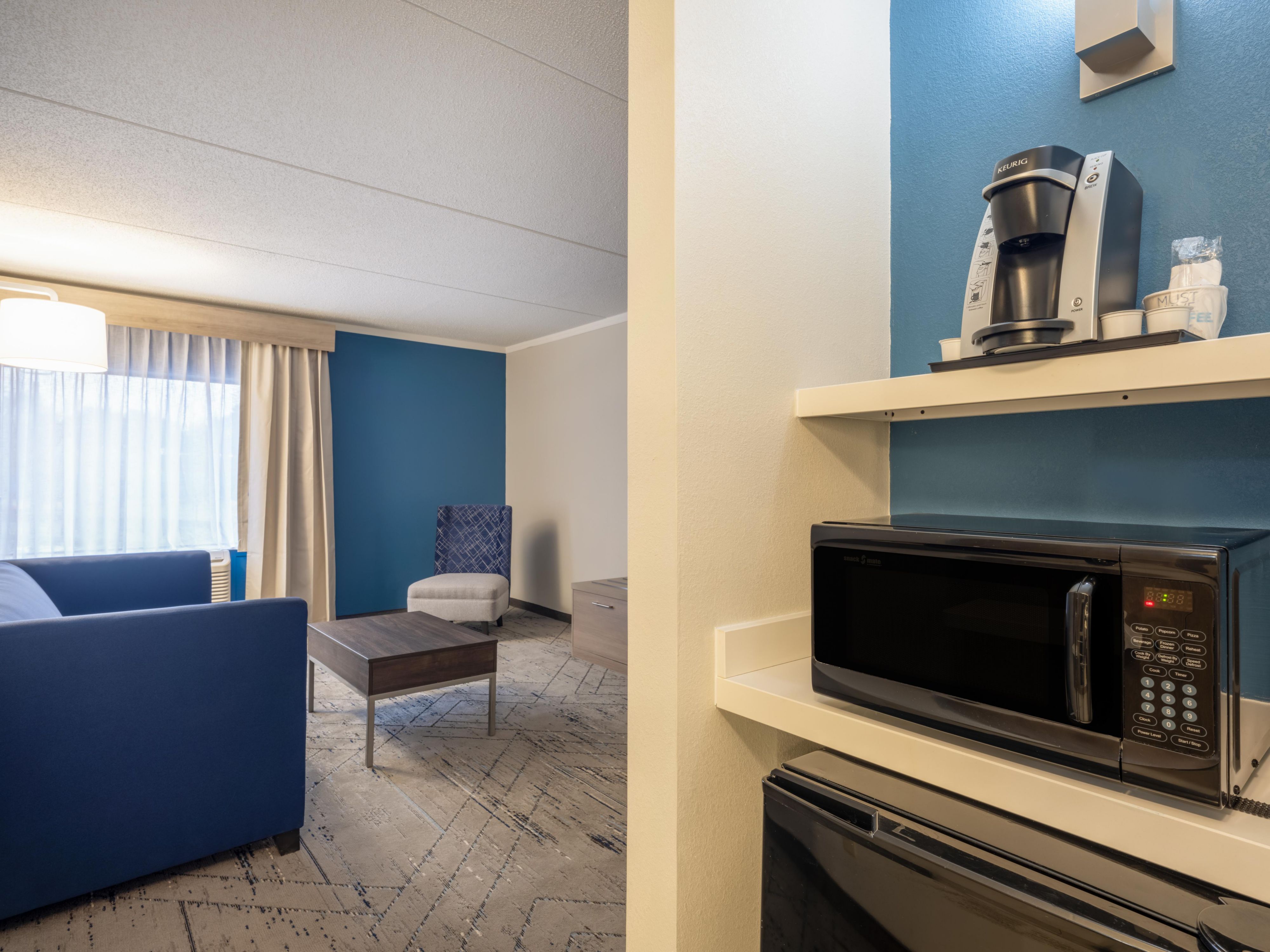 Our hotel caters to the smart traveler with well designed rooms and suites, a 55-inch smart TV, mini-fridge, microwave, coffee maker, and ample USB ports for all your devices. Stay fit in our large gym, and enjoy a free hot breakfast, fast WiFi, and parking that won't cost you a dime. It’s everything you need for a tech-savvy, stress-free stay!