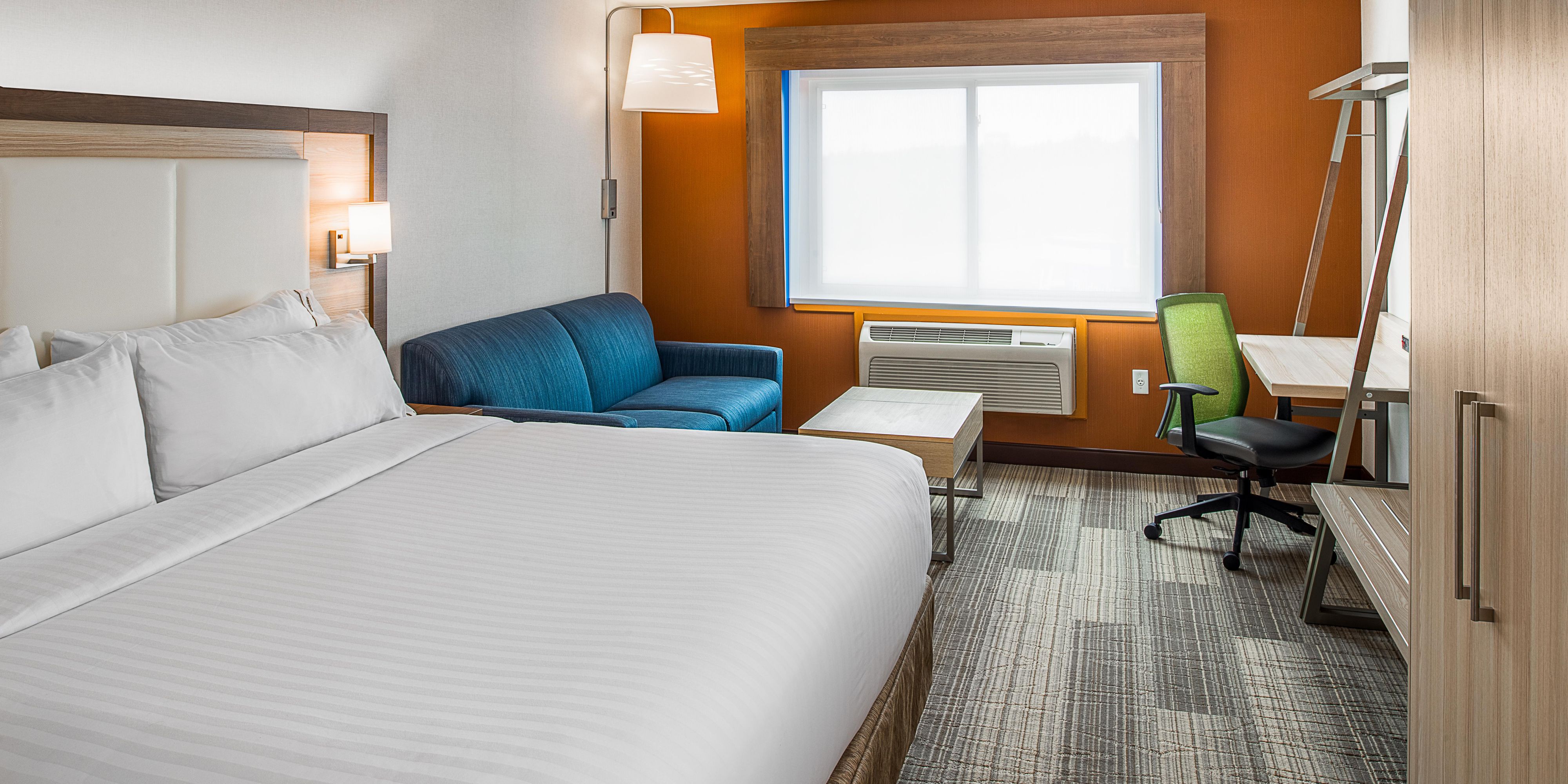 Our spacious rooms are designed for your comfort and productivity. Stay connected with free Wi-Fi while you enjoy convenient amenities like a mini-refrigerator, microwave, and 42” flat-screen TV. Relish our suites, featuring all the amenities plus a separate living area with a pull-out sofa. Rest comfortably on plush bedding and wake up refreshed.