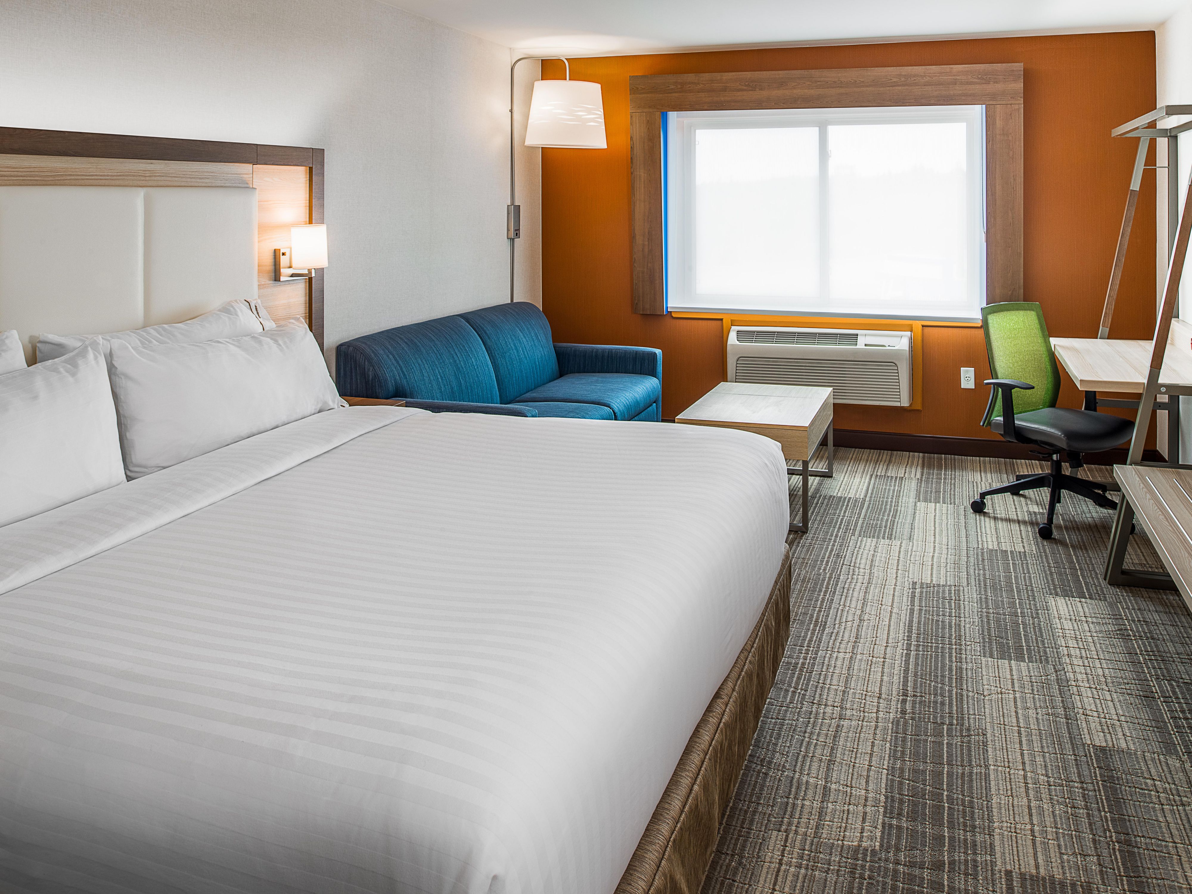 Our spacious rooms are designed for your comfort and productivity. Stay connected with free Wi-Fi while you enjoy convenient amenities like a mini-refrigerator, microwave, and 42” flat-screen TV. Relish our suites, featuring all the amenities plus a separate living area with a pull-out sofa. Rest comfortably on plush bedding and wake up refreshed.