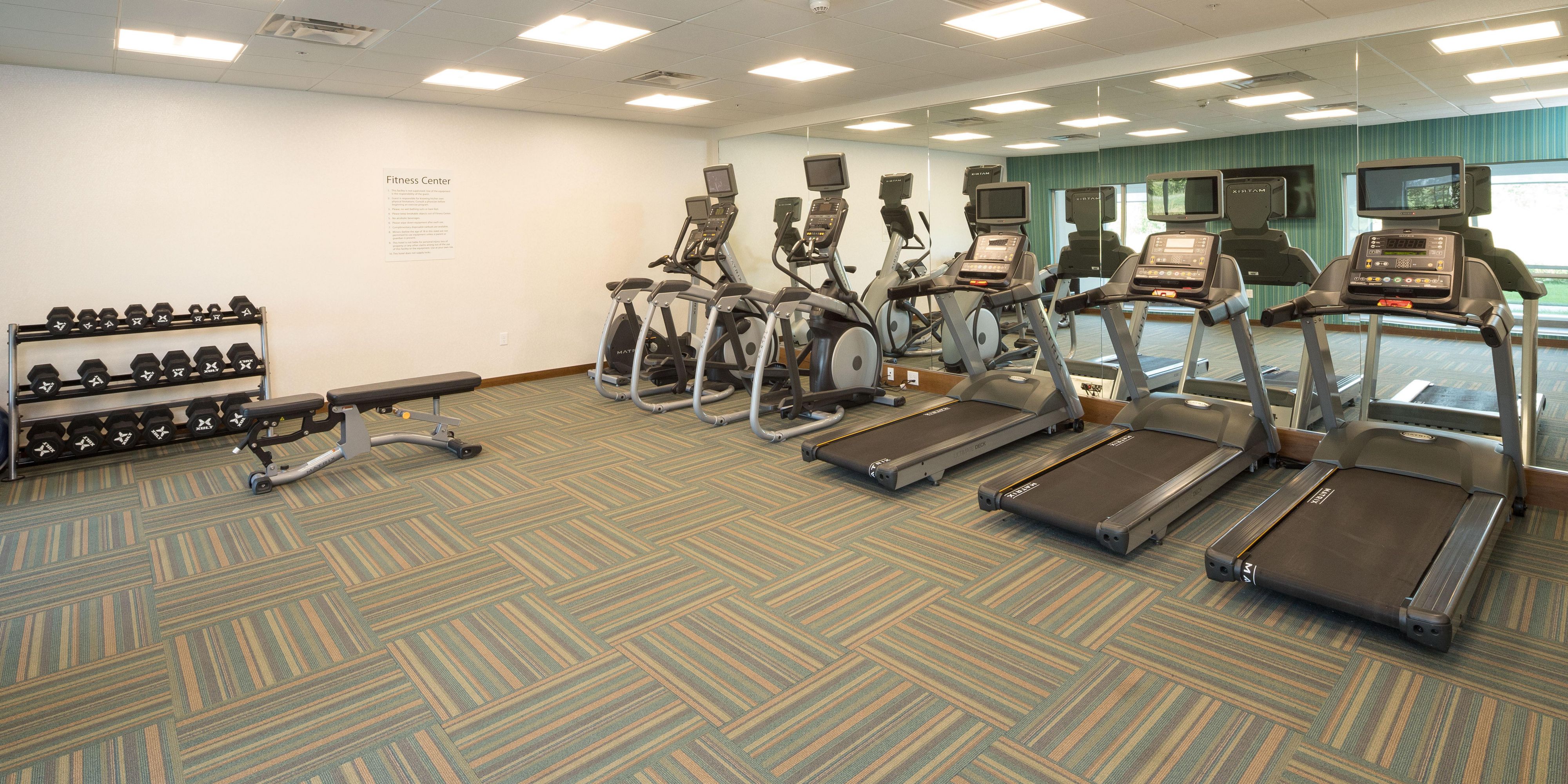 Start your day off feeling your best with our state of the art fitness center!  We are proud to have three treadmills, two elliptical machines, and a stationary bicycle that all include their own television screens so you can choose what you watch while you sweat!  Free weights and yoga mats are available in our open workout area.