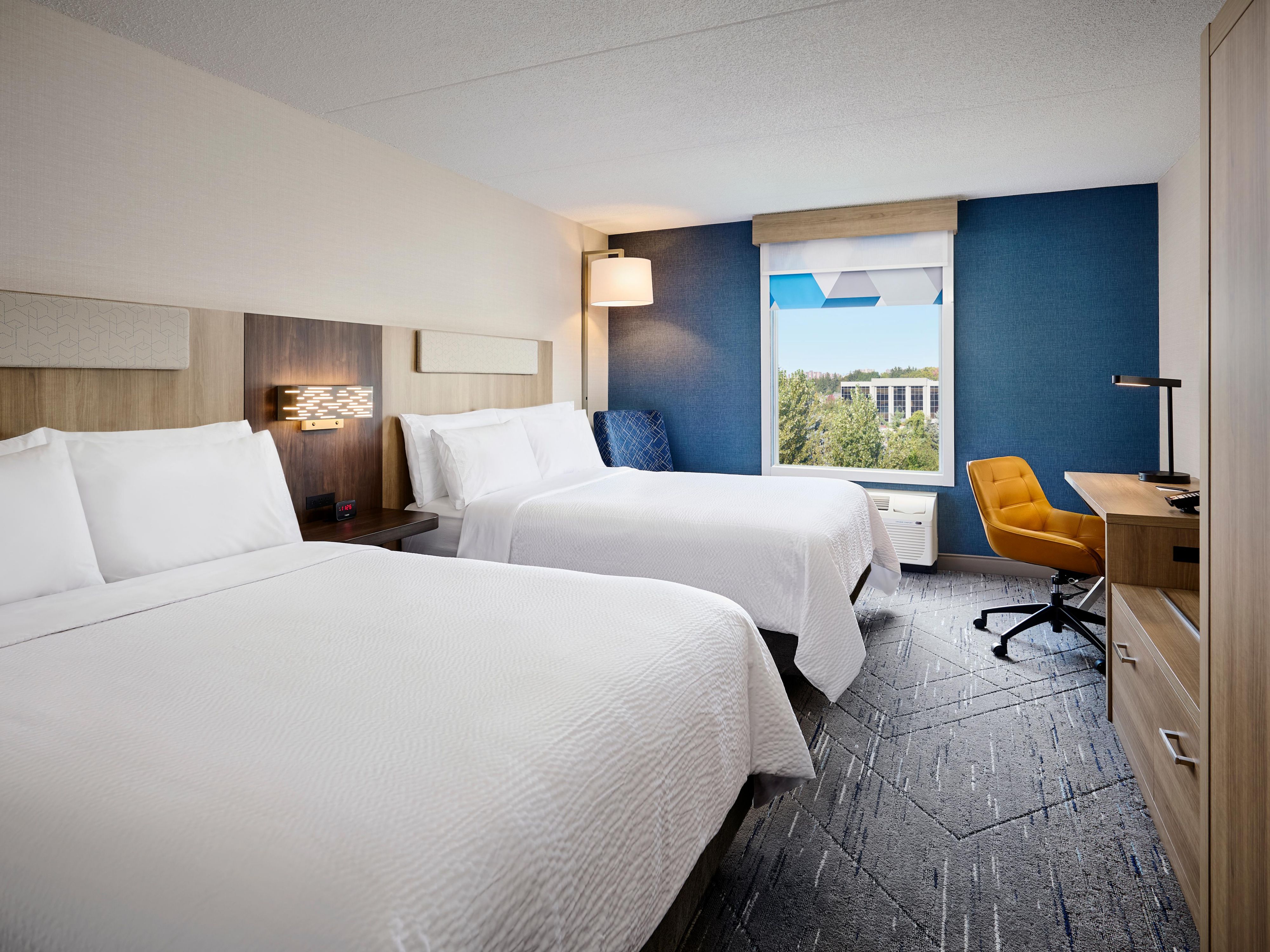 Our guestrooms offer everything you need, and nothing you don't. Featuring two charging stations for your devices, and free Wi-Fi, allows our guests to be productive during their stay. Winding down? Relax, watching our 55" LED TV's. Settle in with our quality linens, distinctively designed black out shades that will ensure a restful sleep.