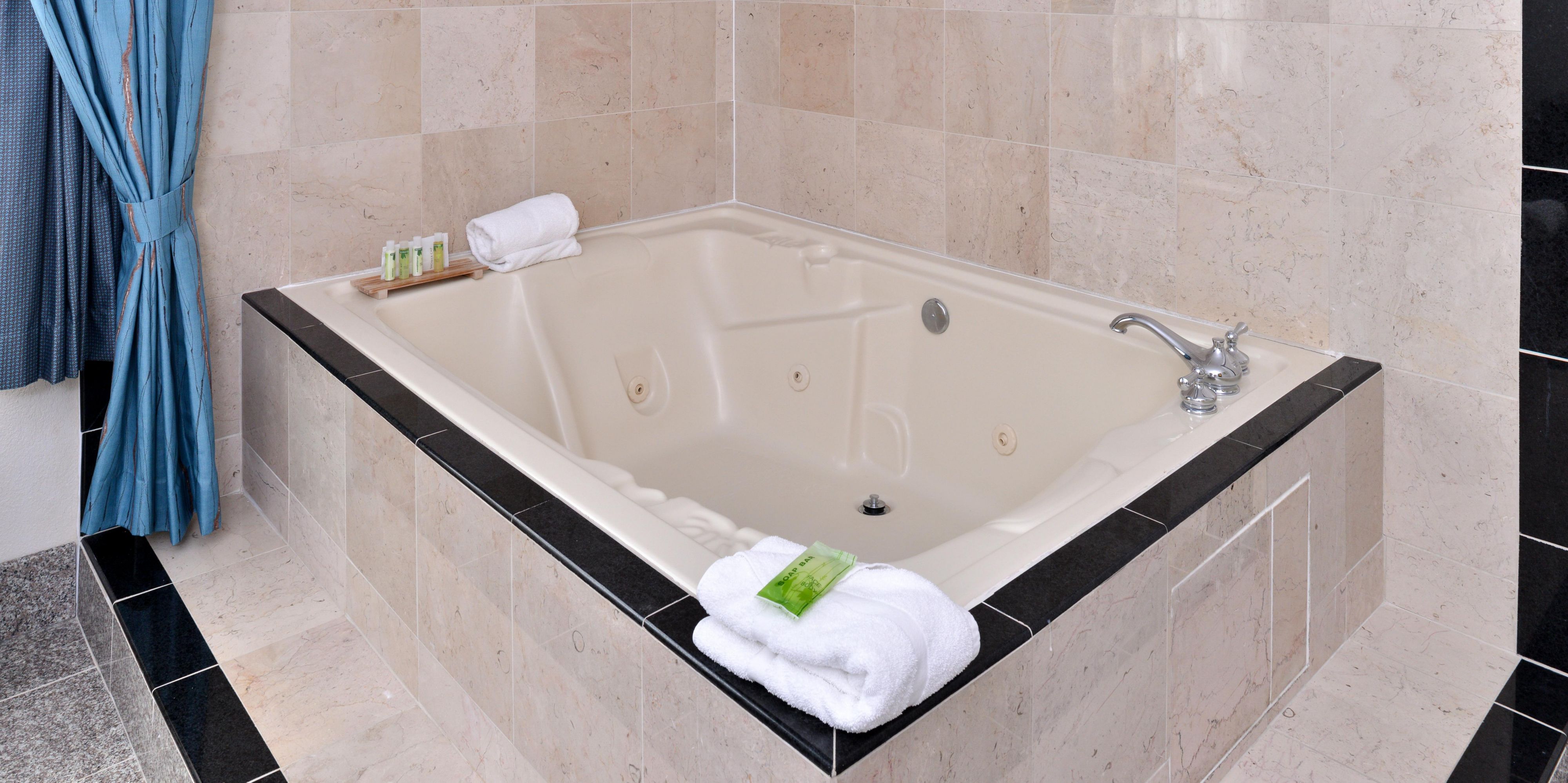 Whether you are in need of deep relaxation or want to treat your love to a romantic getaway, our King Whirlpool Suite room is ready to host you.