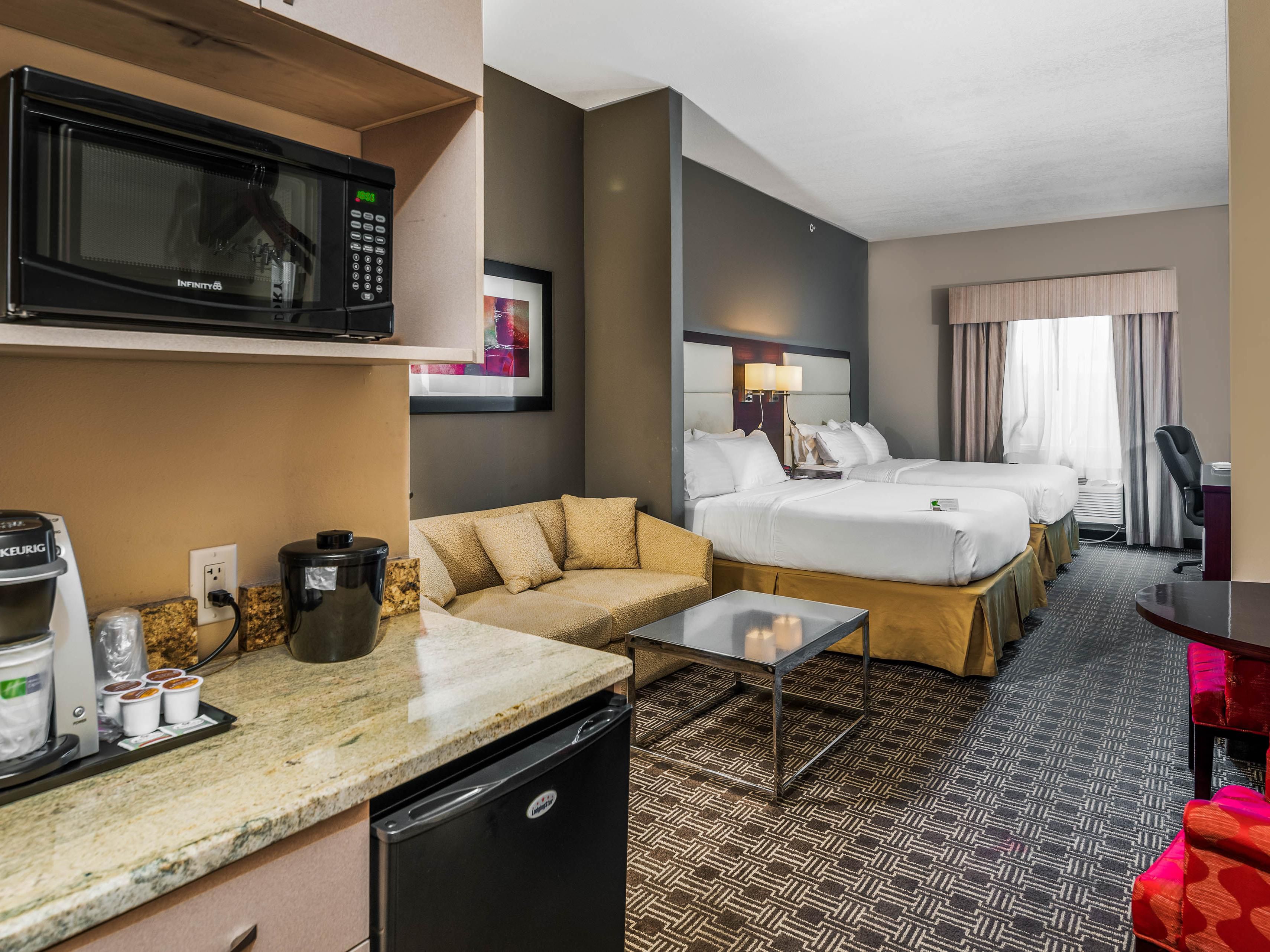 Relax in comfortable, renovated rooms with plush bedding, blackout shades, a mini-fridge, and a microwave. Stay connected with free Wi-Fi and enjoy extras like a dedicated workspace and Keurig® coffee maker in every room.