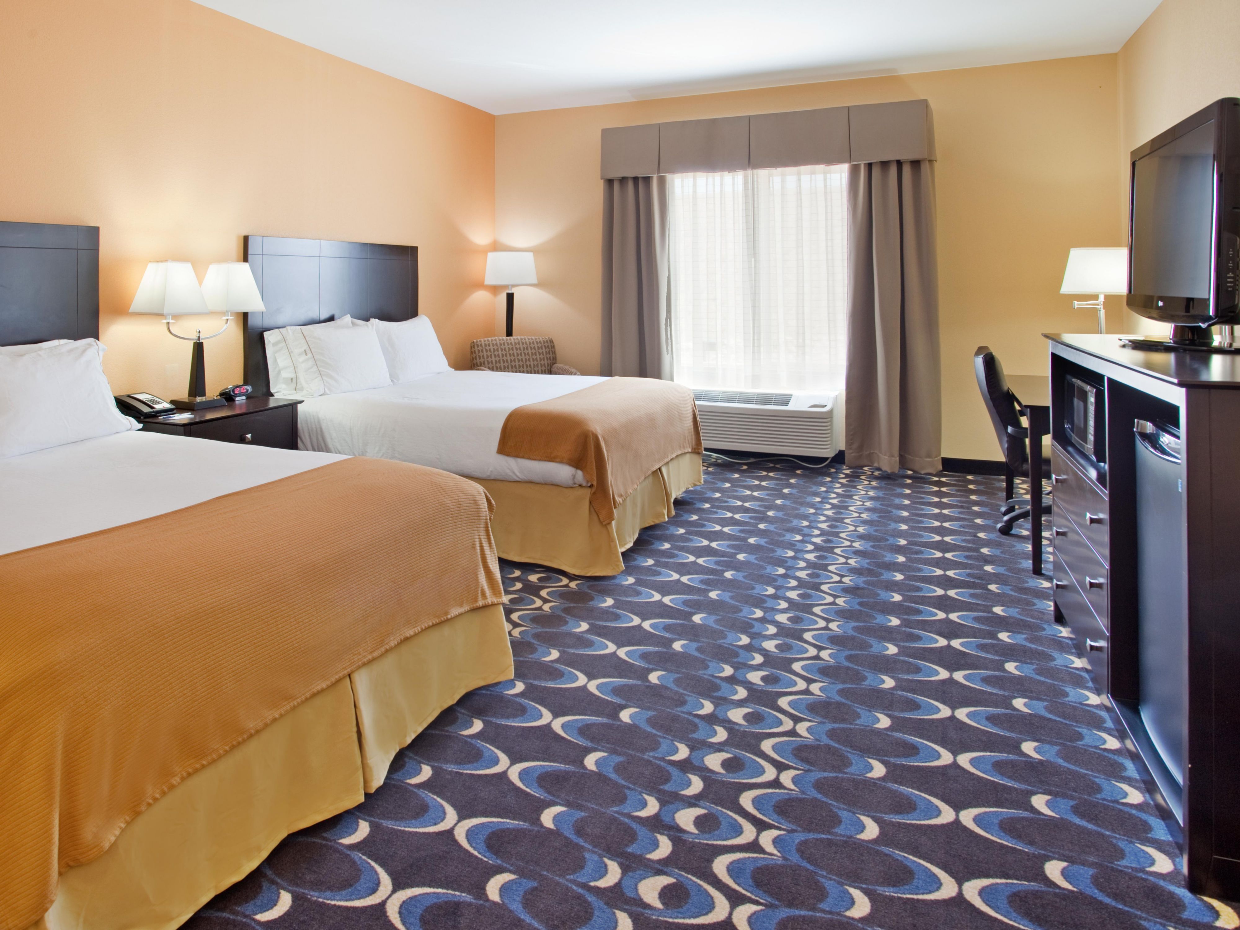Relax in our 2 Queen Beds, includes housekeeping services. 
