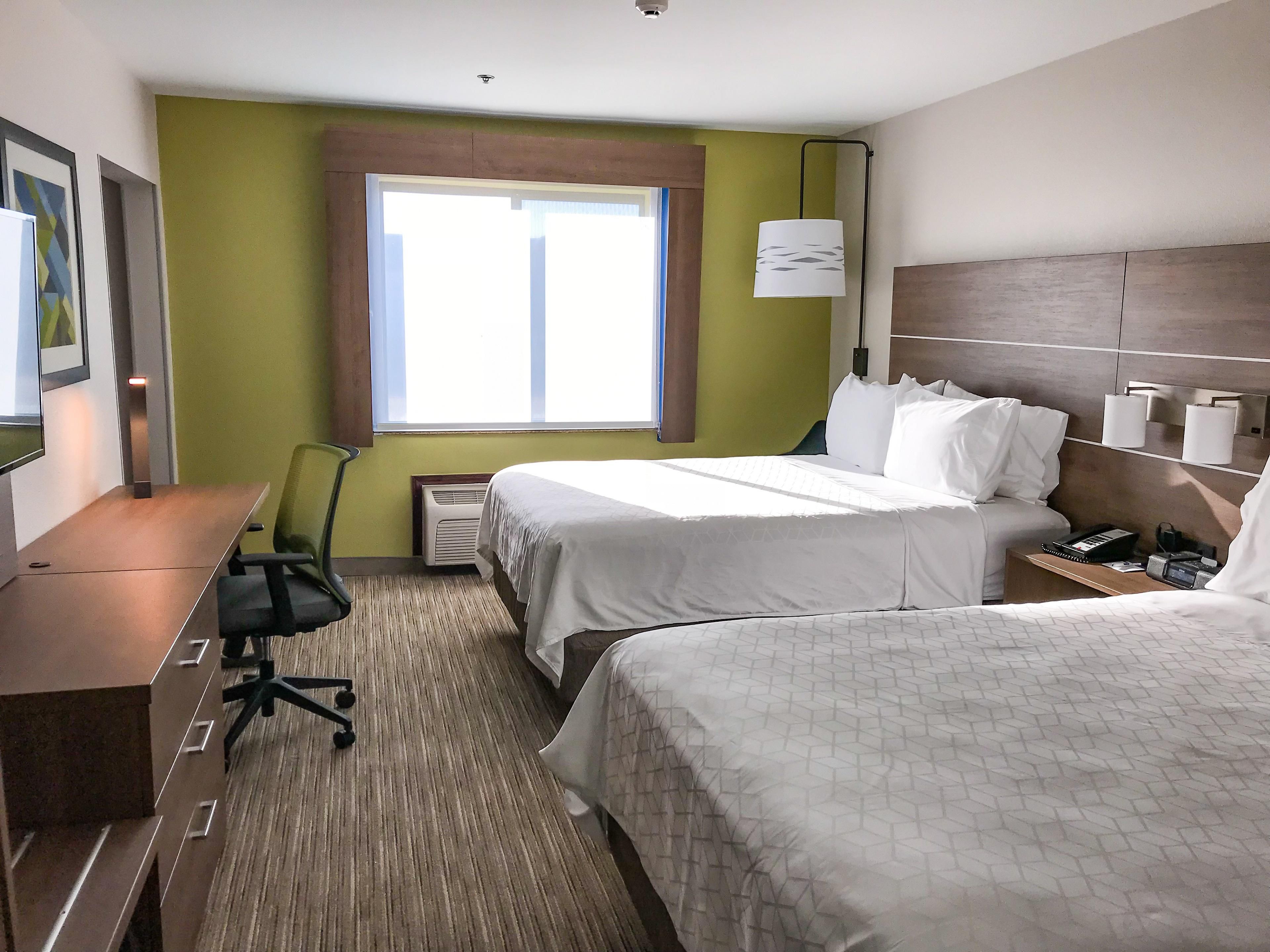 Relax in our Two Queen beds, includes housekeeping services.
