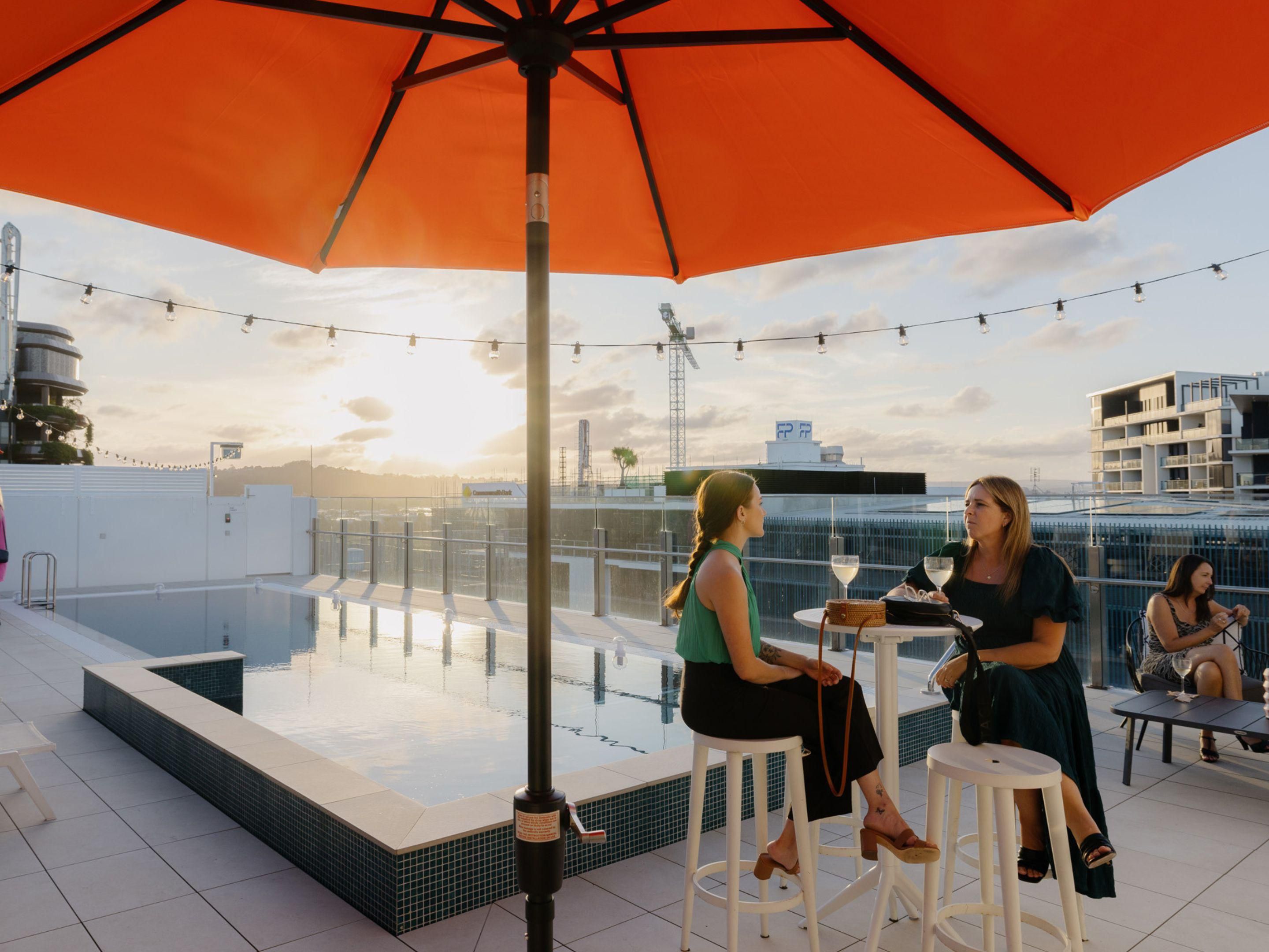 Sunset drinks by the rooftop heated pool