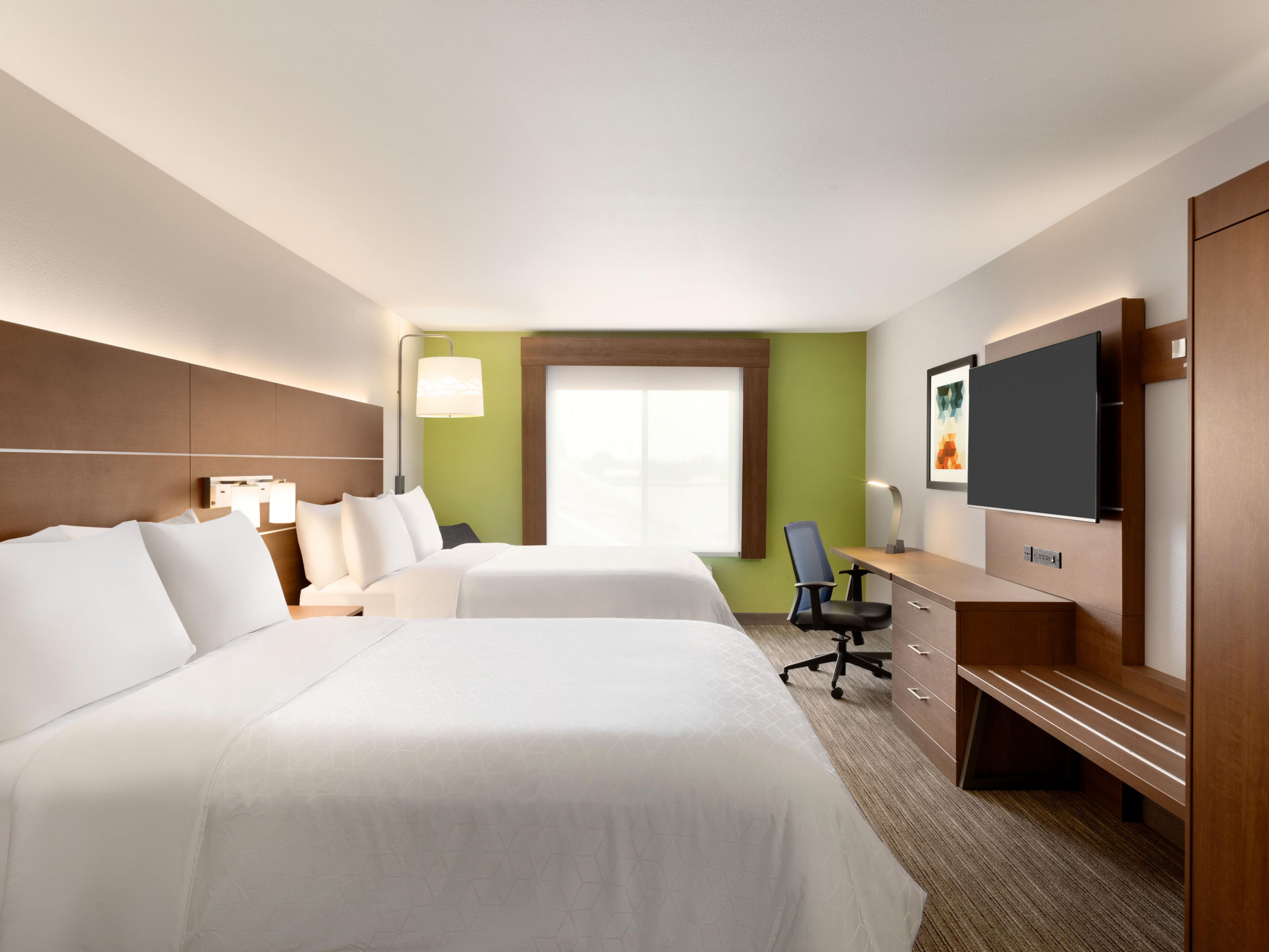 Relax with plush bedding, 55" TV and great desk for room to work