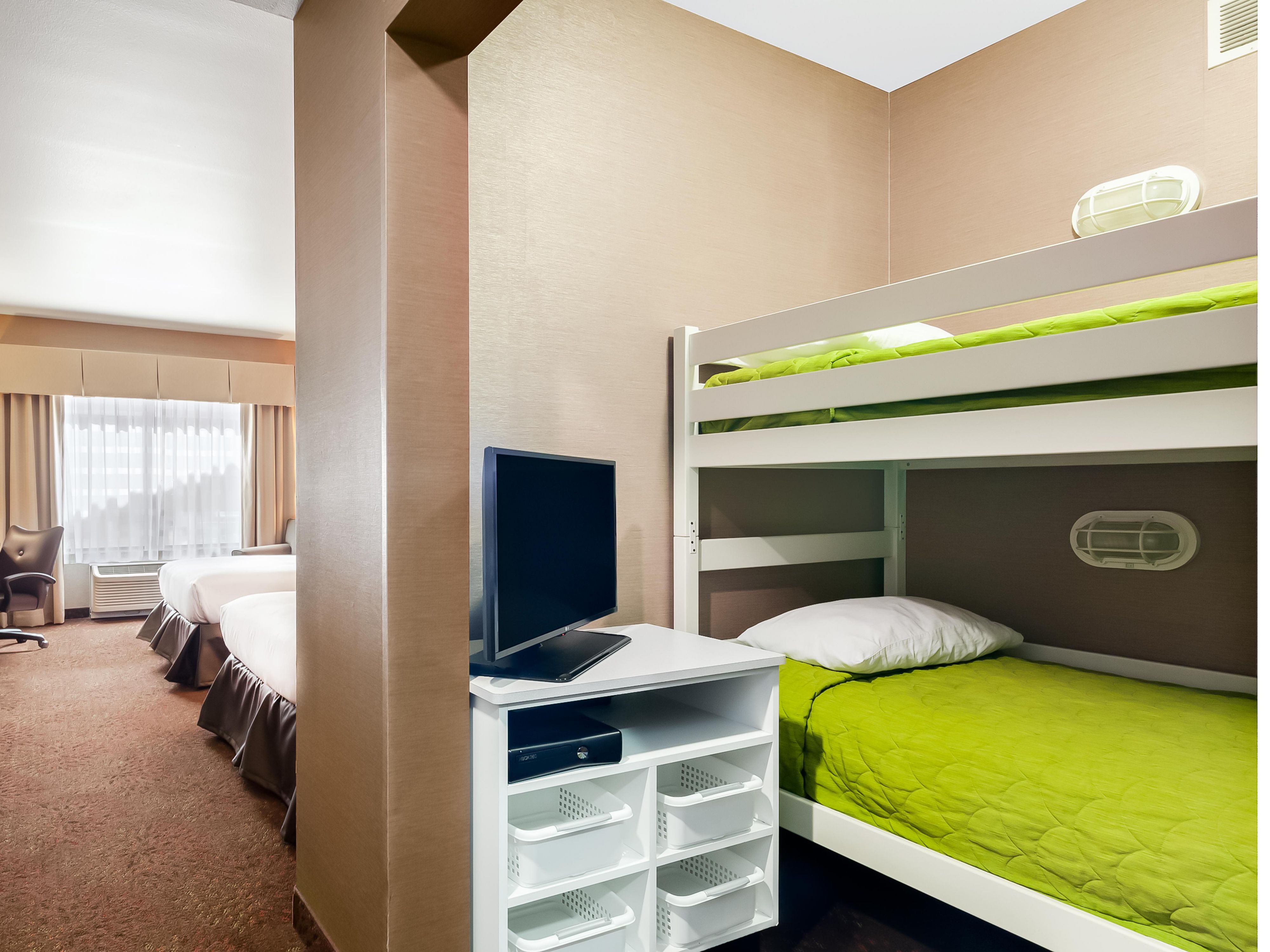 Traveling with kids is more fun with rooms designed especially with your children in mind. Holiday Inn Express & Suites Missoula Northwest offers Kid Suites that include bunk beds, colorful decor, and an in-room gaming system with a TV. With just enough extra space for all, Kid Suites keep your family comfortable and entertained!