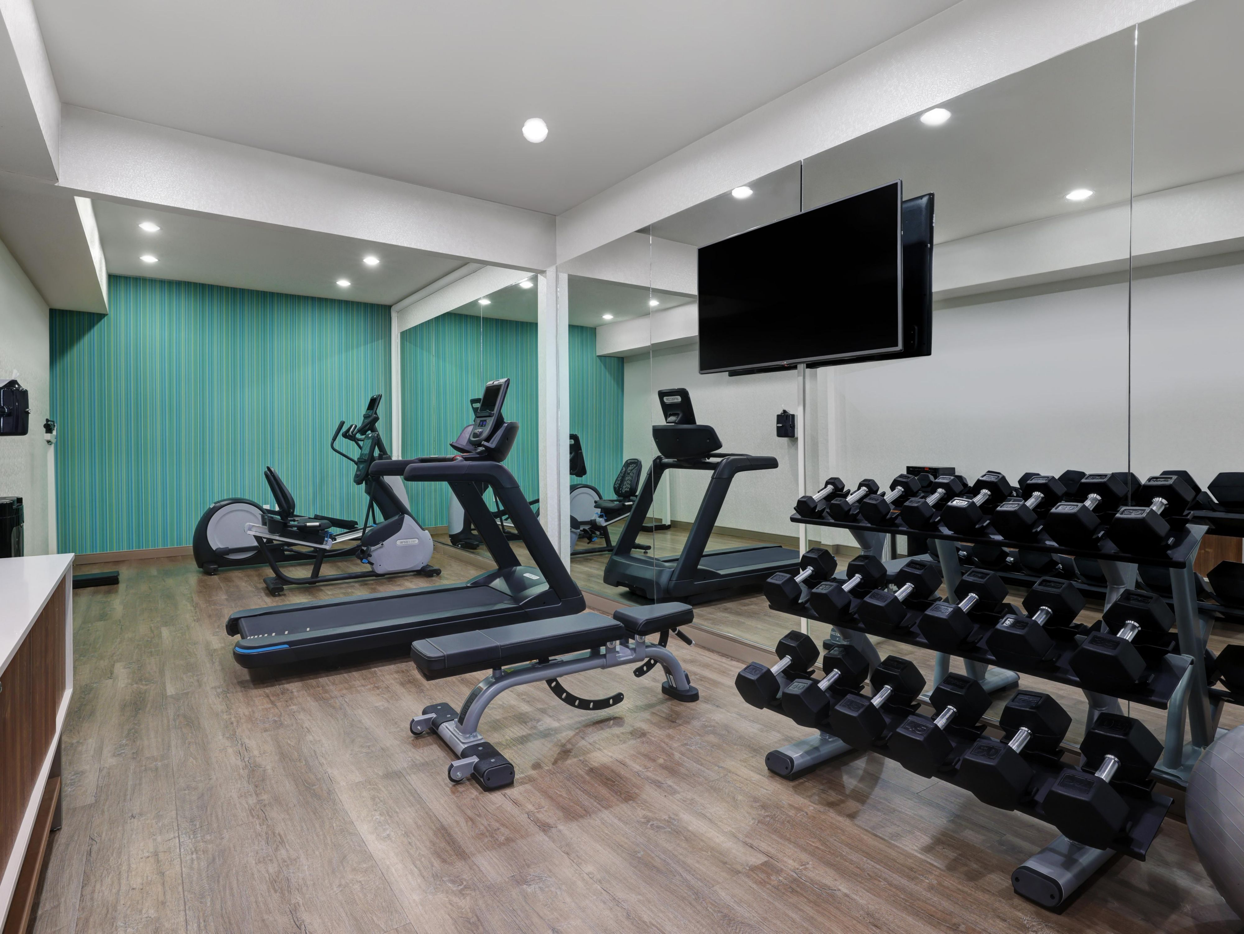 Fitness center with free weights, treadmill, and more!