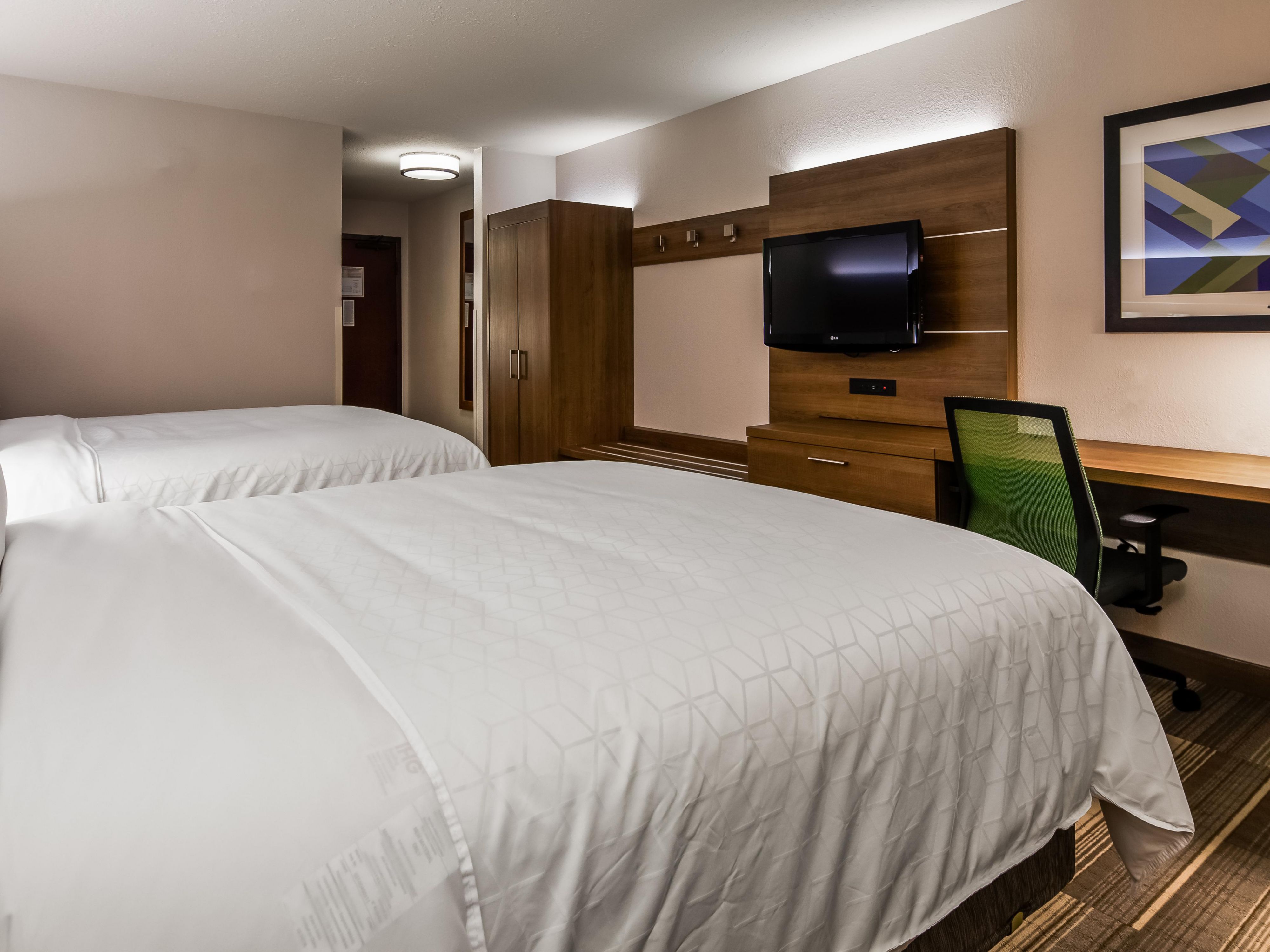Unwind in our spacious guest rooms with thoughtful amenities.