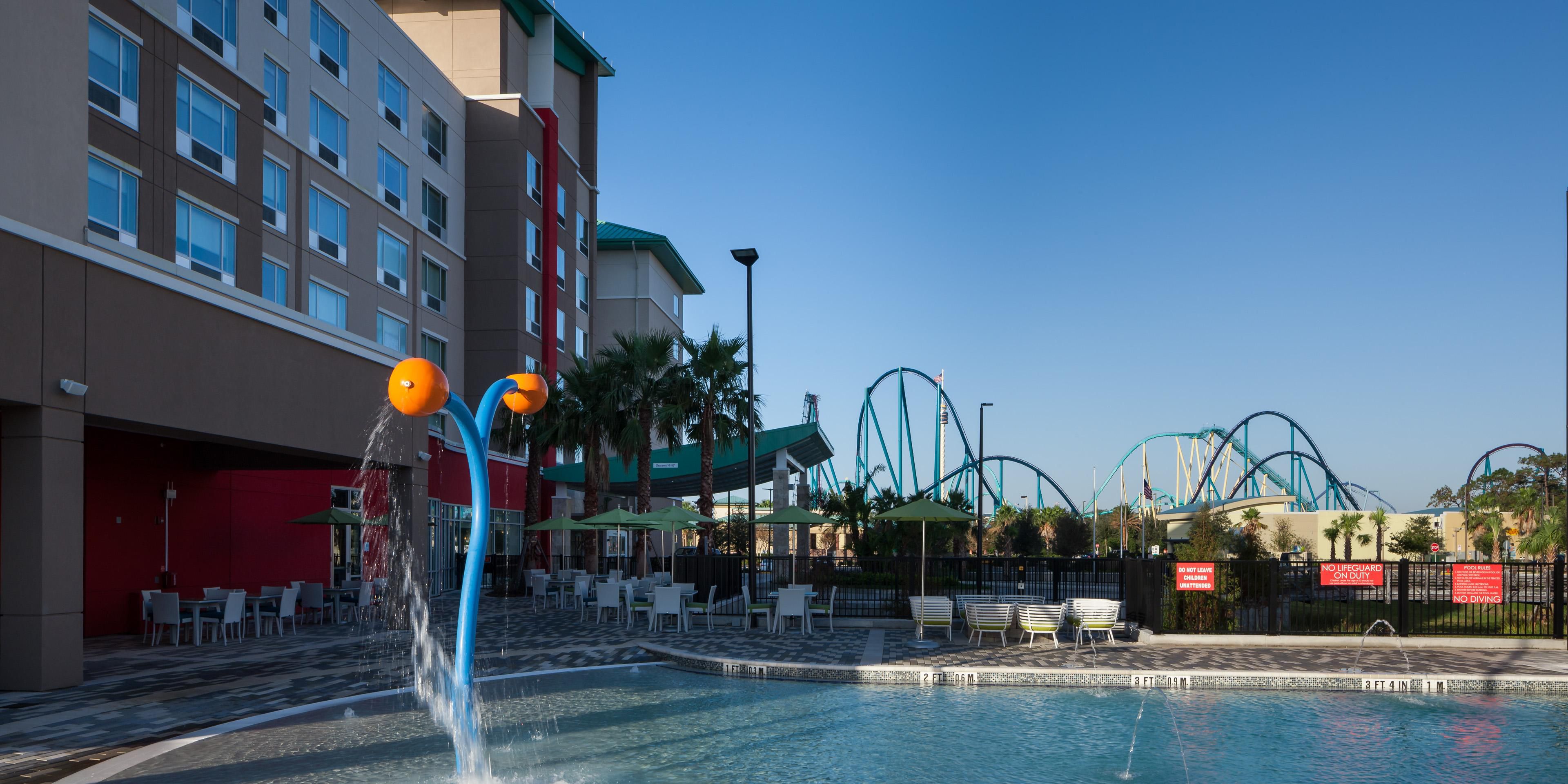 Sunny skies call you to our zero entry pool and splash pad!