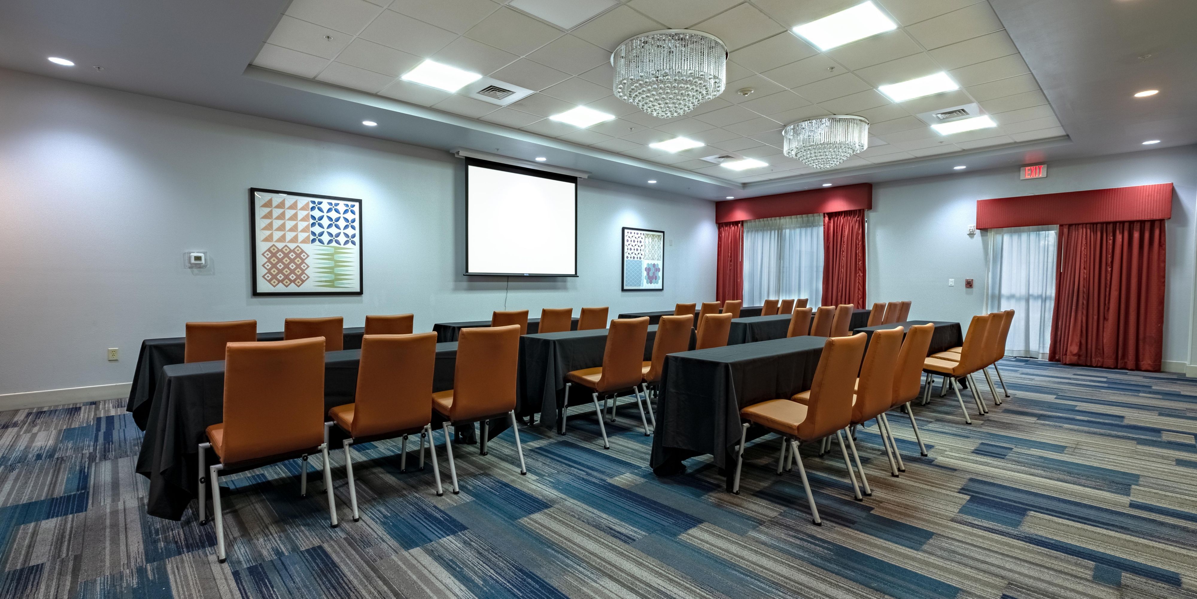 Our beautiful meeting room is versatile and can be used for all events, from business meetings to weddings. Featuring a grand double door entry with elegant chandeliers, this event space is second to none. 