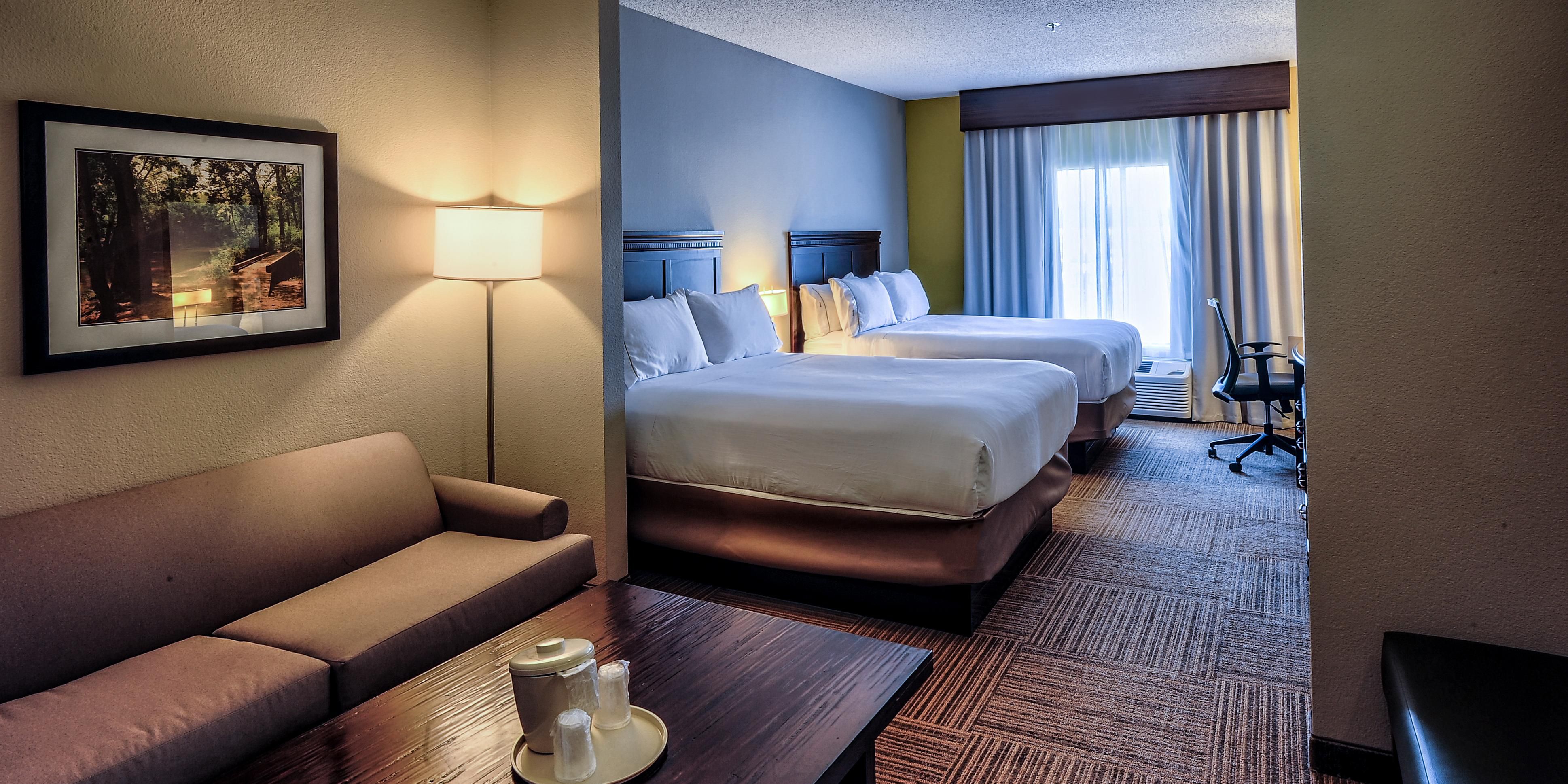 Enjoy a sleeper sofa and extra seating such as armchairs and benches. Microwave, wet bar, and mini refrigerator are all included. You have your choice of a King bed or two Queens.