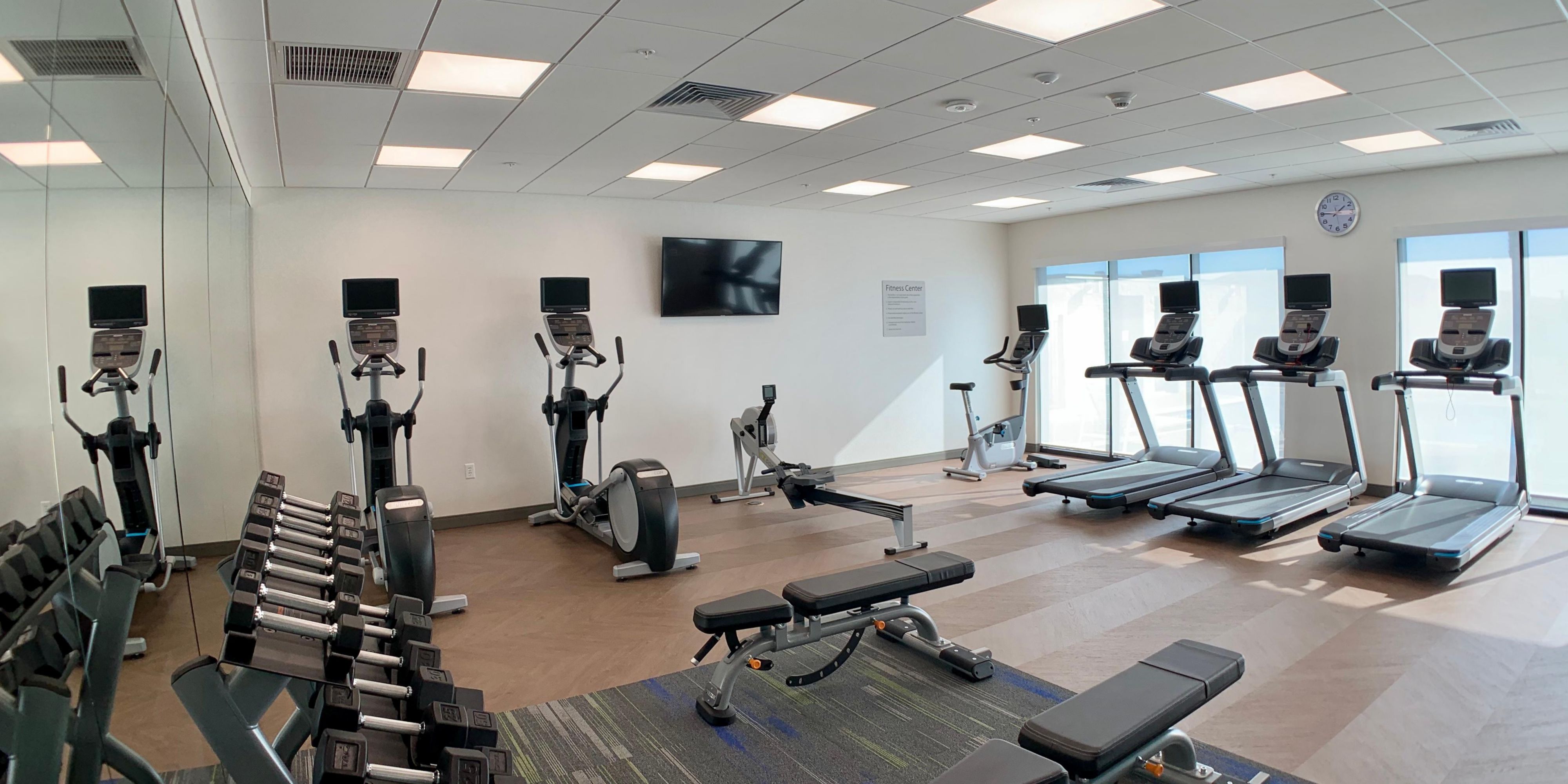 Stay fit while staying Smart. Our spacious fitness room features free weights, rowers, ellipticals, and treadmills. 