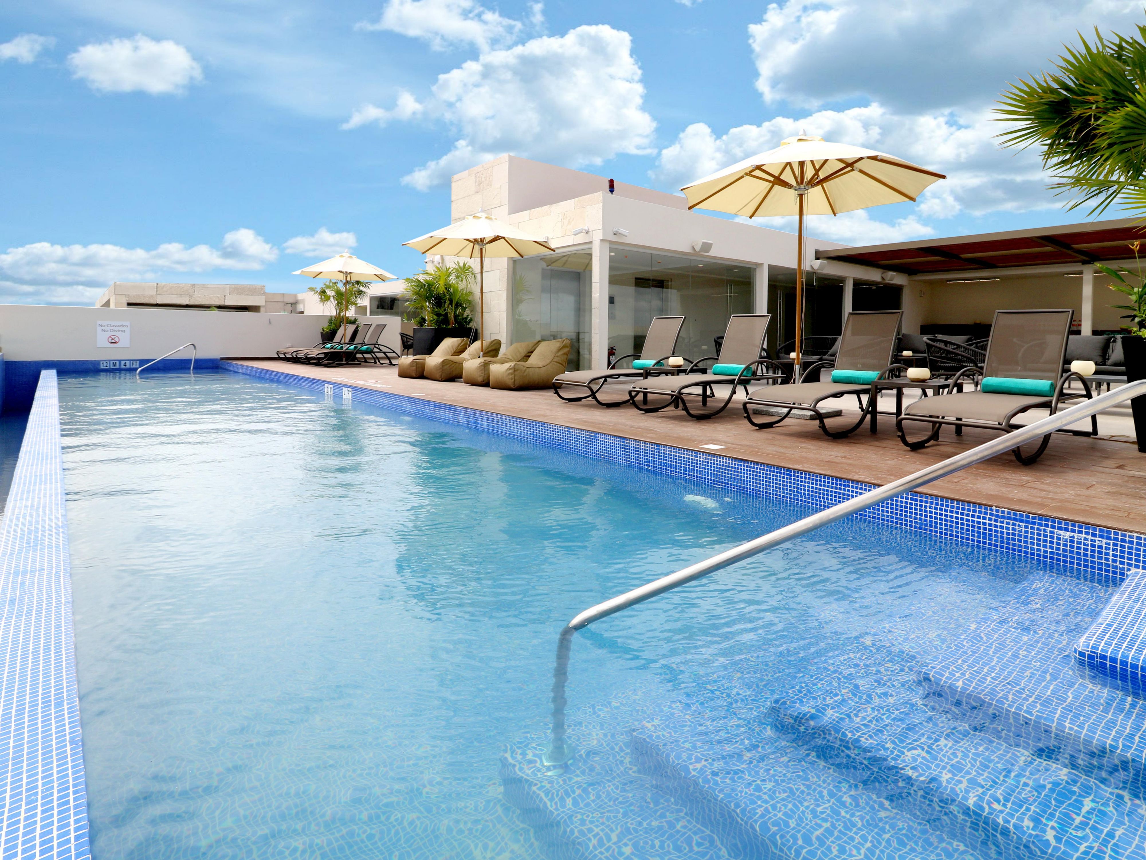 Take in sweeping views of Playa del Carmen from the rooftop pool, where the sparkling city meets the Caribbean Sea. Whether enjoying a swim or lounging in the sun, this elevated spot offers the perfect mix of relaxation, scenery, and coastal charm.