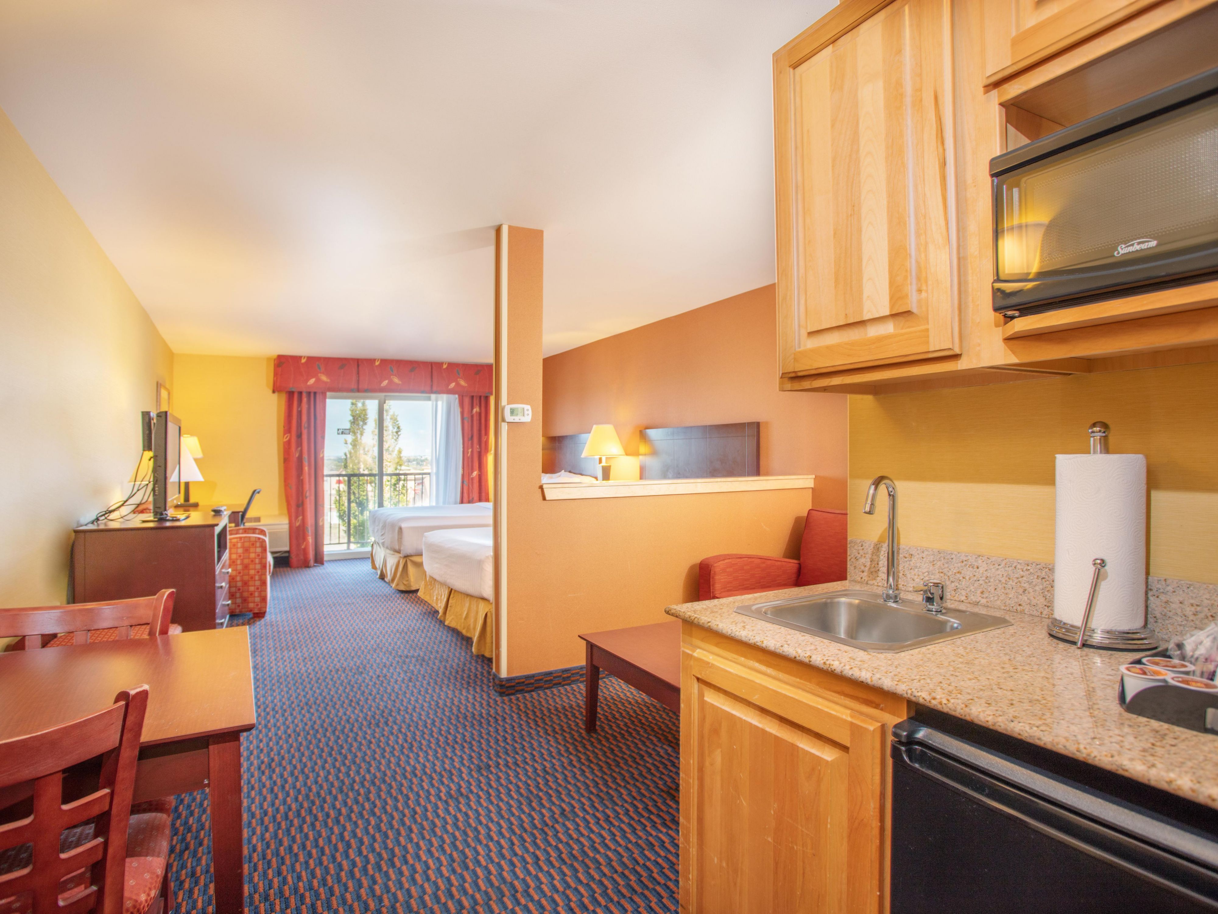Suites Two Queen Beds with a Sofa Sleeper, Refrigerator & Coffee