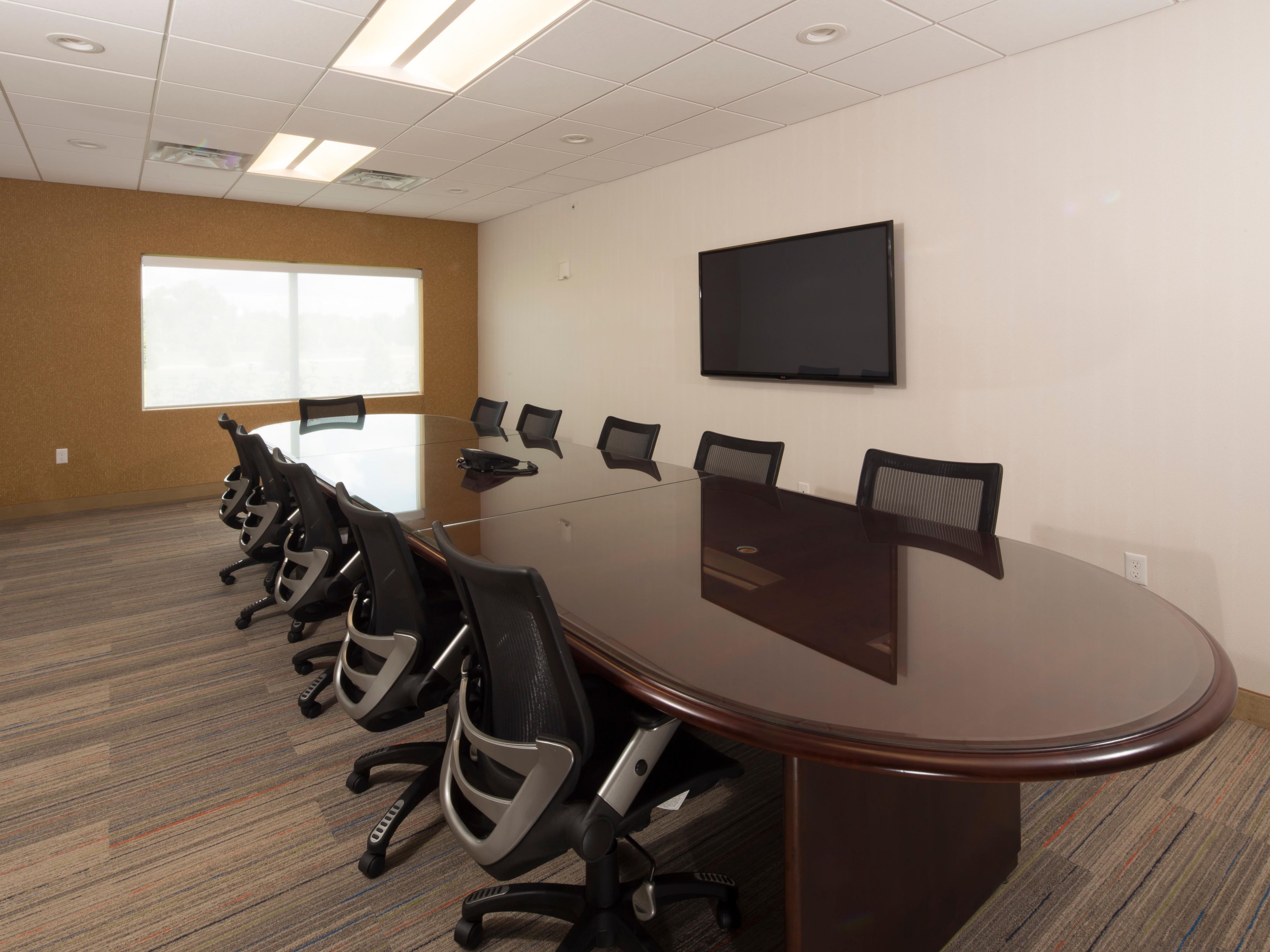 Our quaint 15-person board room is the perfect space for your group. Equipped with up to date technology including a teleconference line and flat screen TV for presentations as well as a kitchenette including a refrigerator and microwave, complimentary Wi-Fi and Business Center is available for any of your office needs.