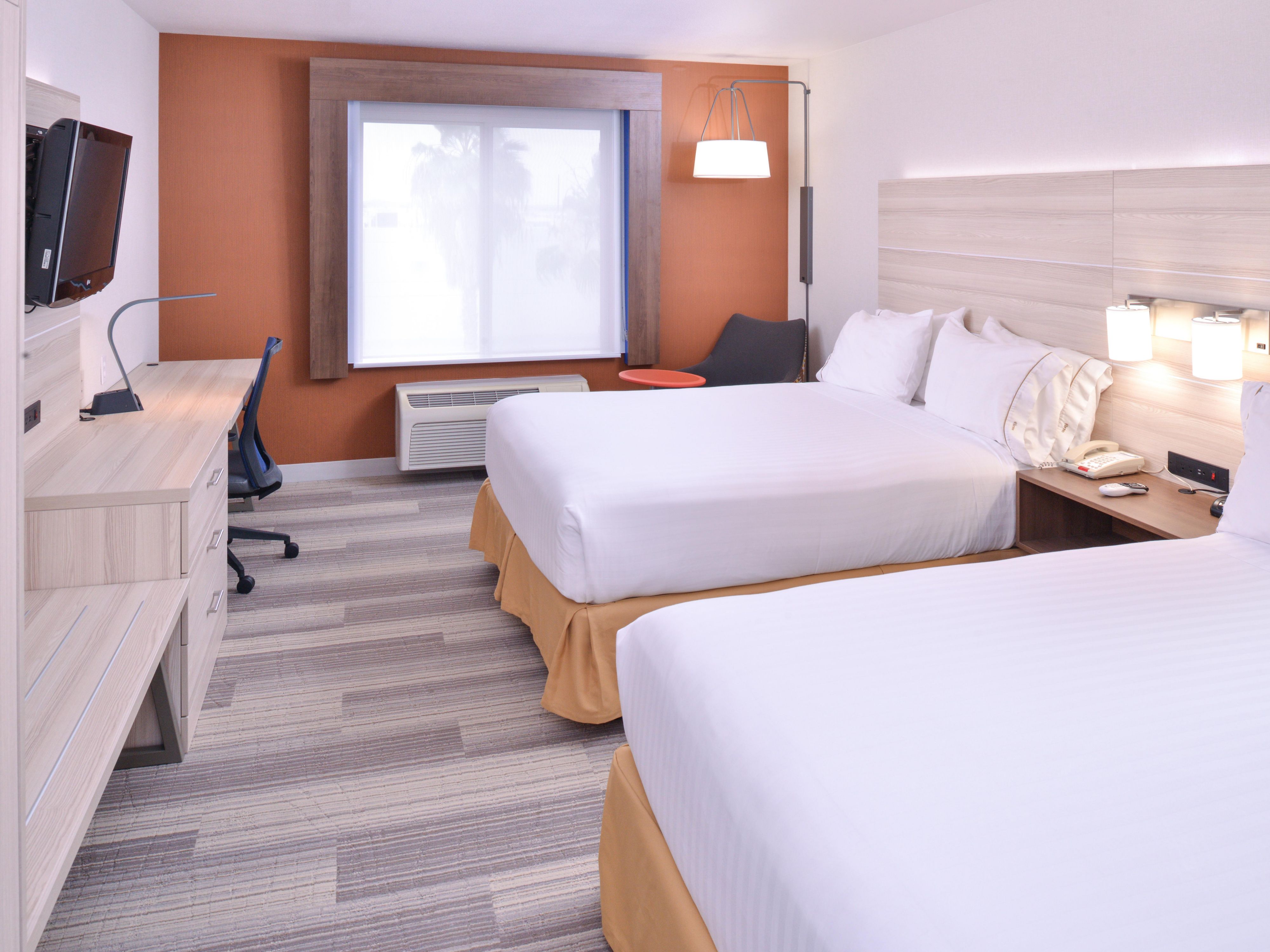 Two queen guest room with in-room safe and Keurig coffee maker.