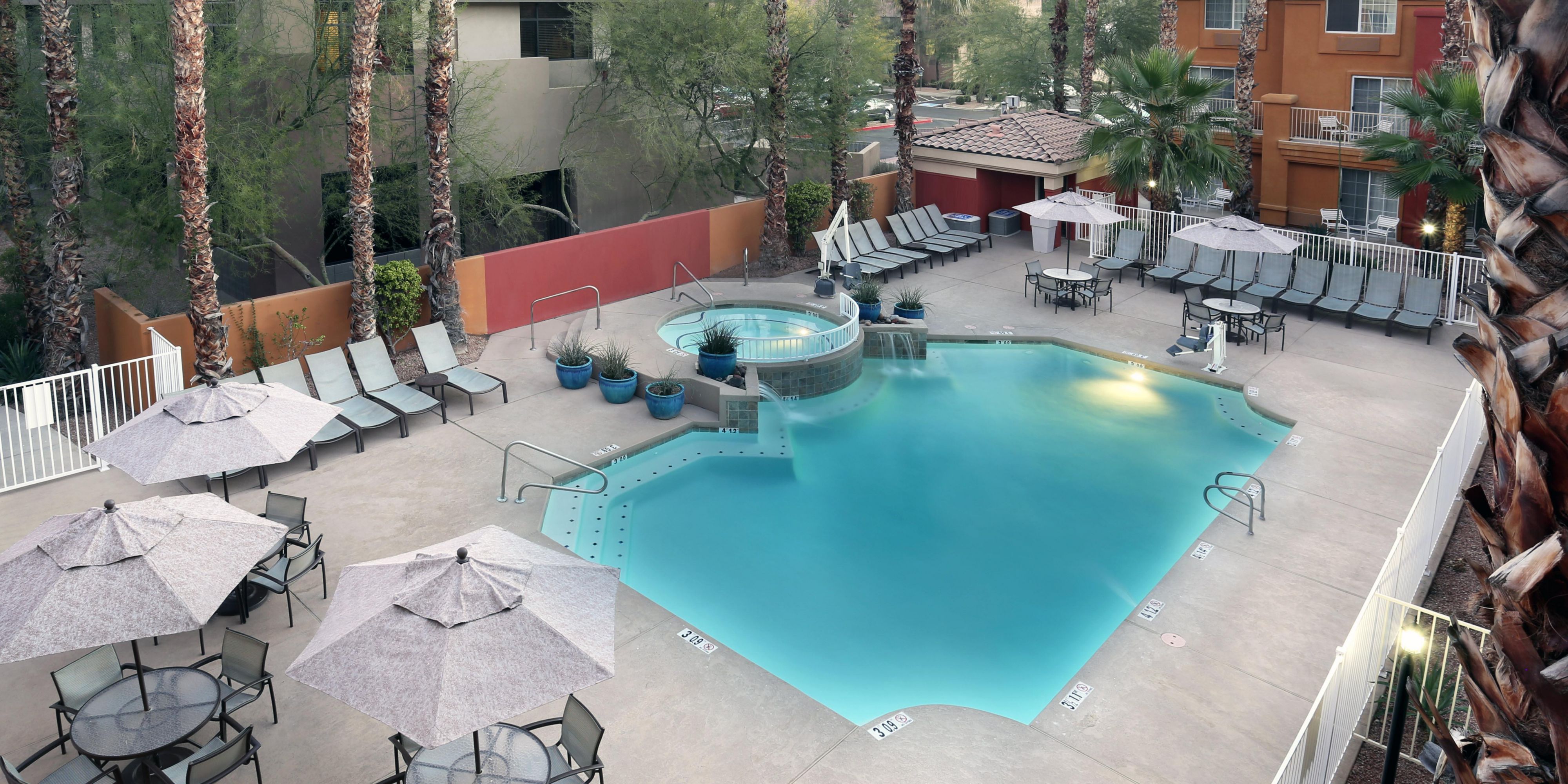 Check out our beautiful outdoor pool with a variety of outdoor seating!  It's a beautiful area to read the paper with a cup of coffee in the morning, swim in the hot afternoons, or relax in the outdoor hot tub after a day out and about.