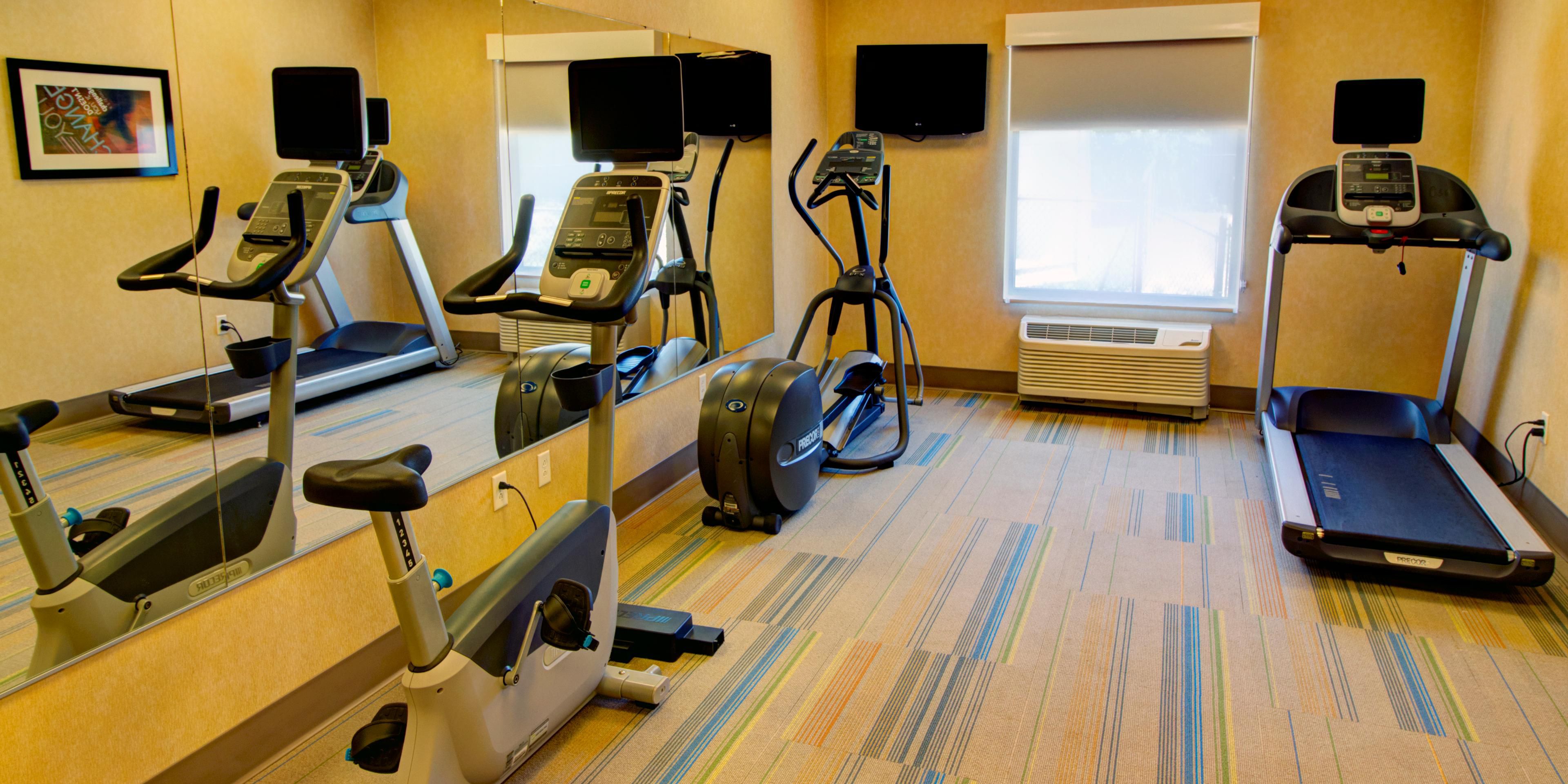 Keep in shape while you are away from home. Check out our fitness facility with free weights!
