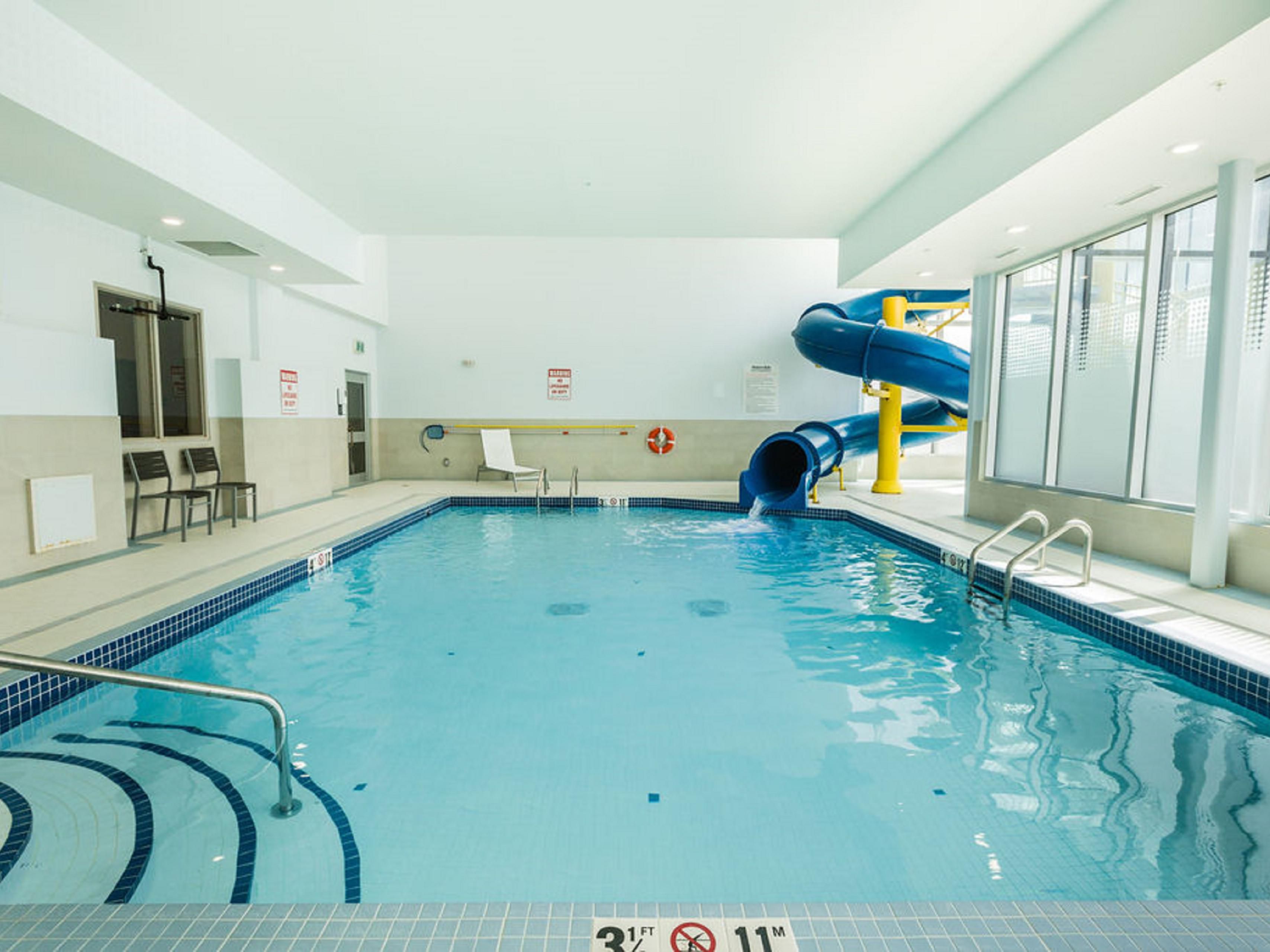 Head over to our pool room for peak relaxation and fun! The kids in your group will love the waterslide and large pool for splashing and swimming, while the adults can look on from the warmth of our hot tub. With lounge chairs and fresh towel service, it’s easy to relax or play at your leisure. 