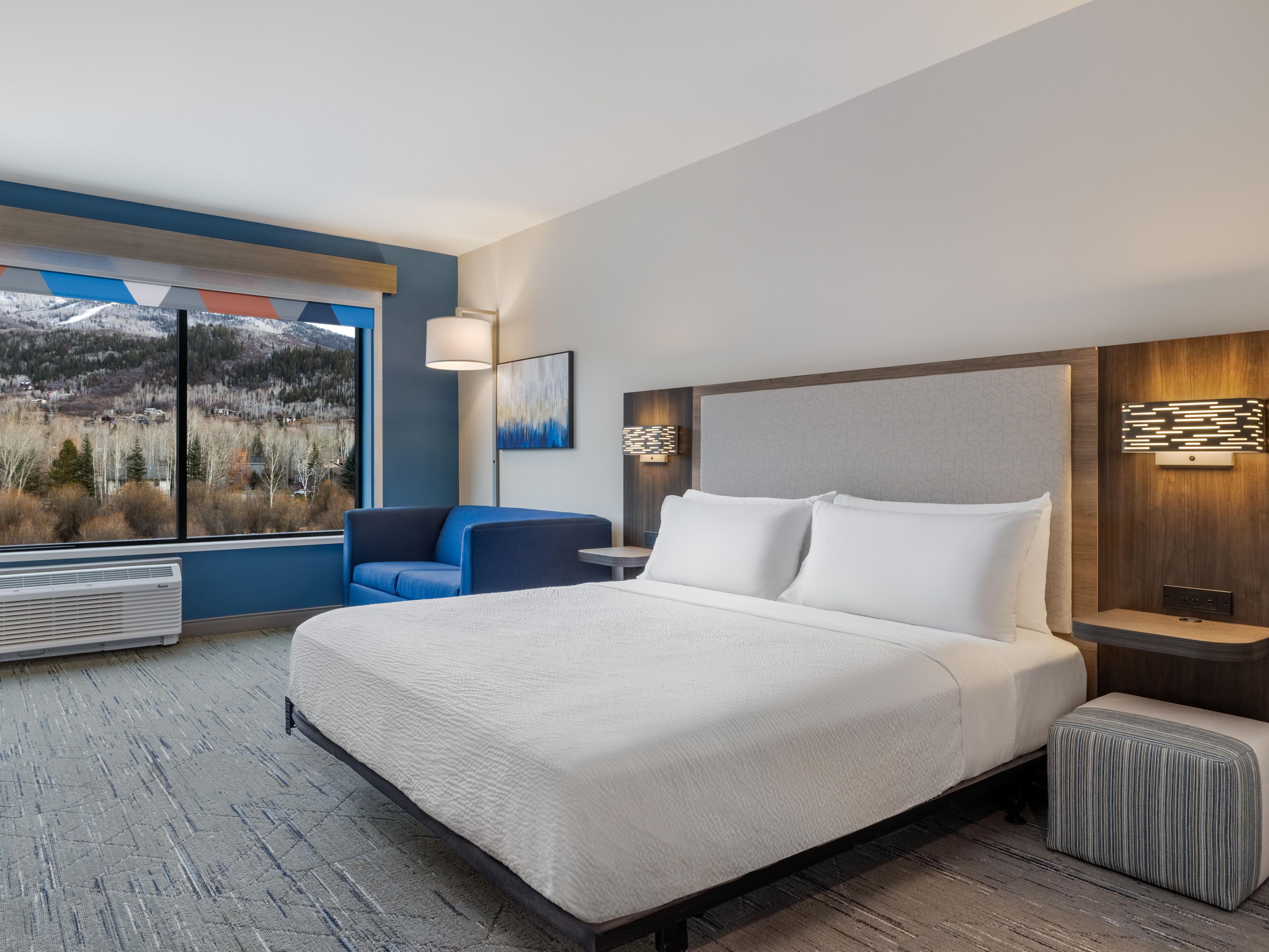 Guest room with a king bed and mountain view