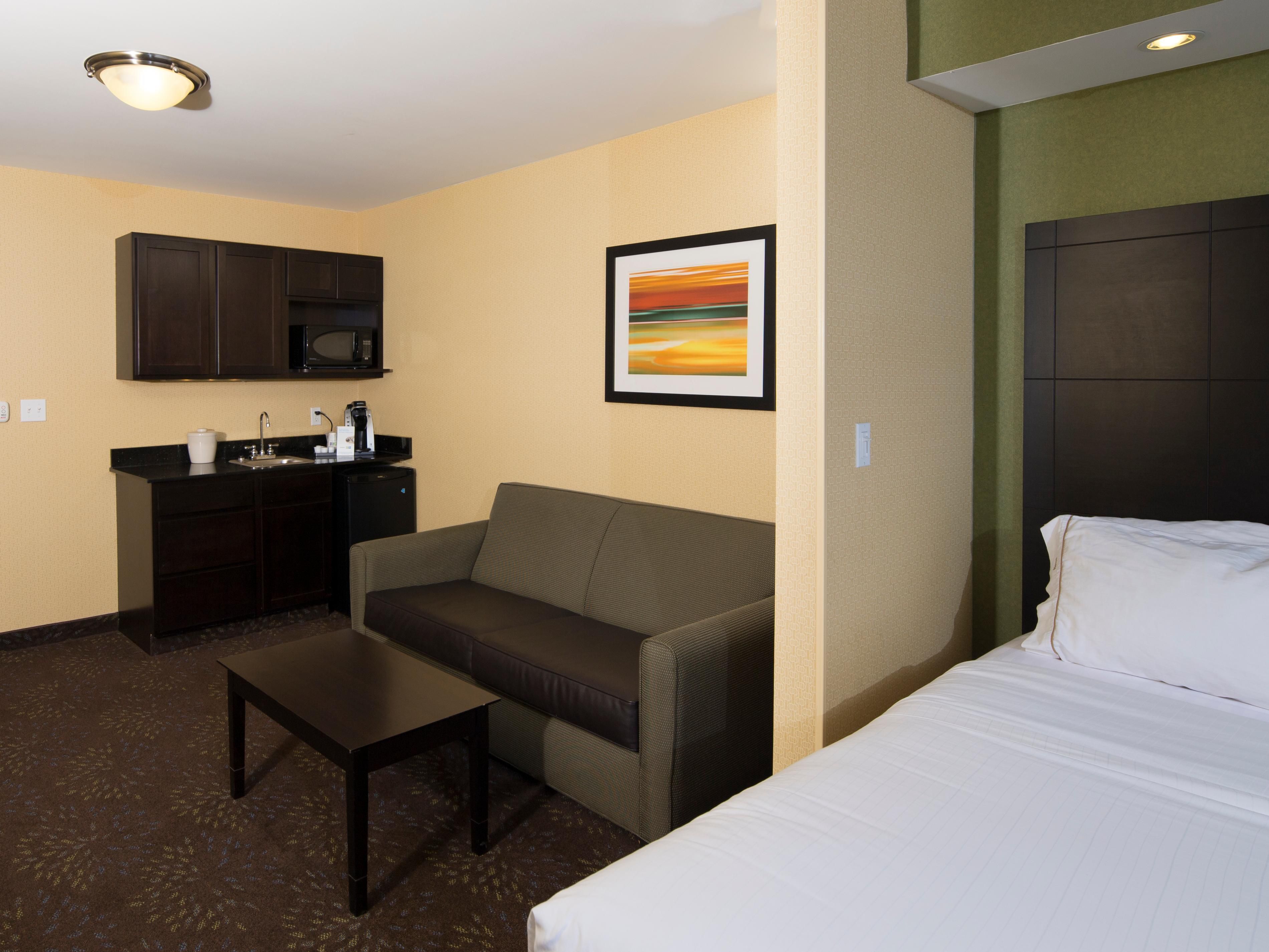 Relax in our oversized suite featuring  pullout sofa and a wet bar